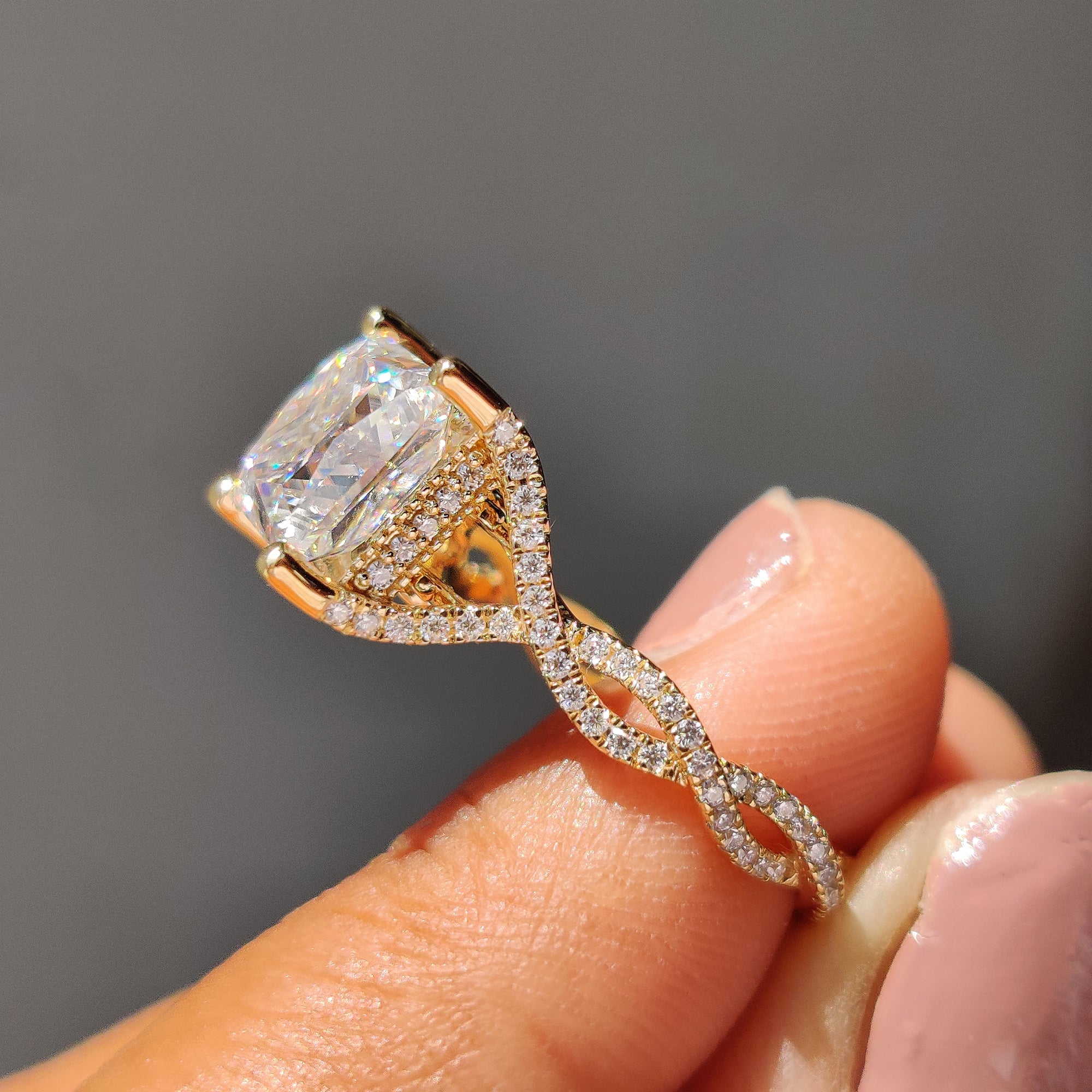Yellow gold ring featuring a beautiful princess cut Moissanite stone.