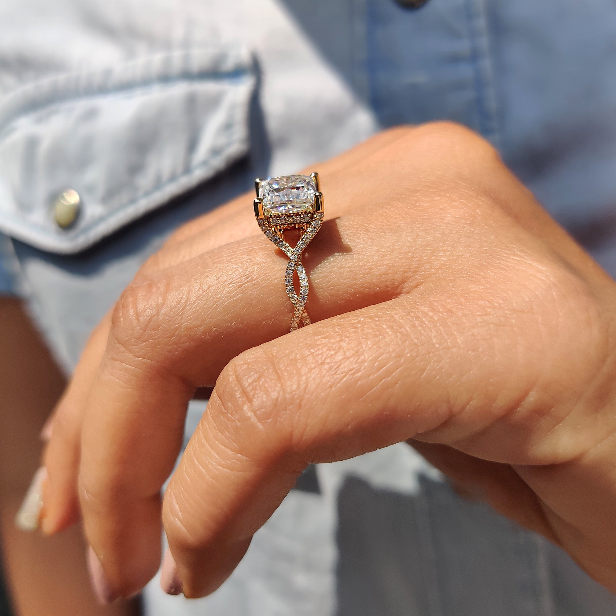 Moissanite engagement ring featuring a unique setting and brilliant cut.