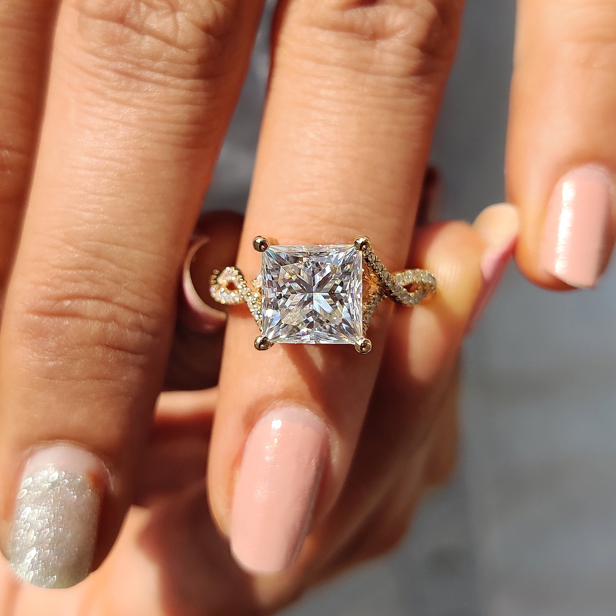 Round cut Hidden Halo ring with a sleek and modern twist.