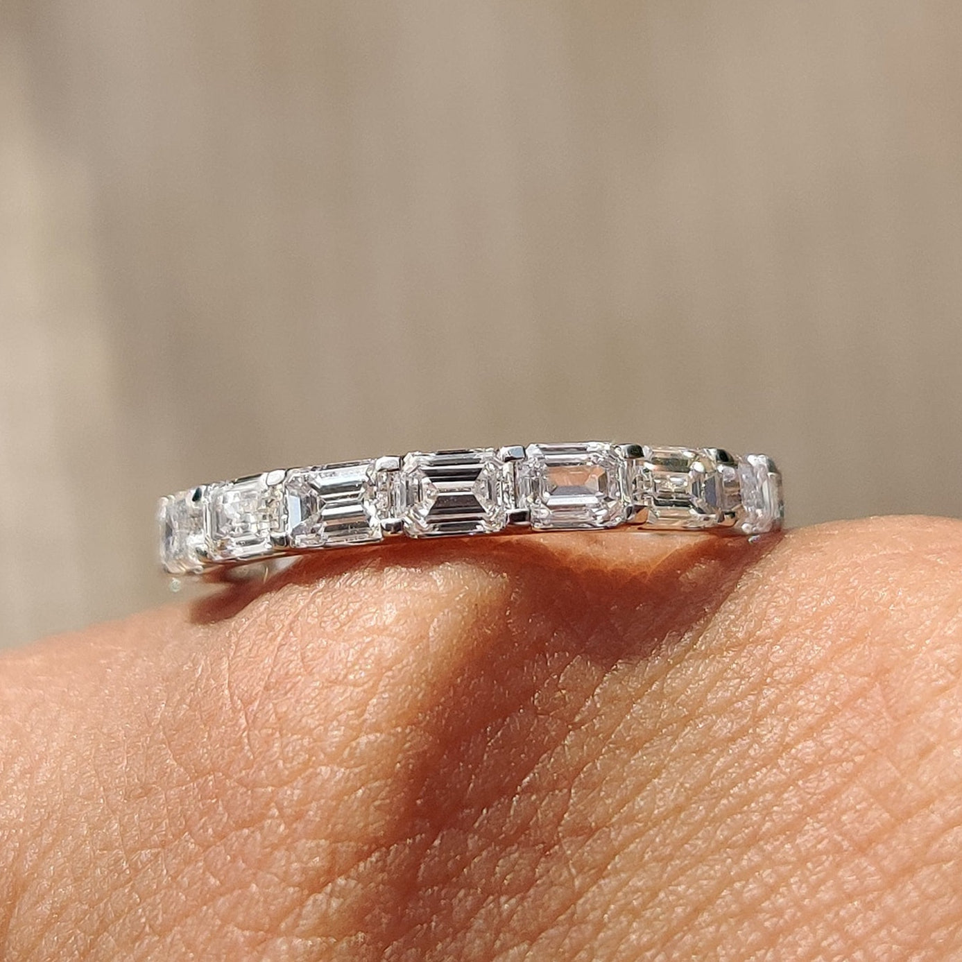 Emerald wedding band with timeless elegance and vibrant style.
