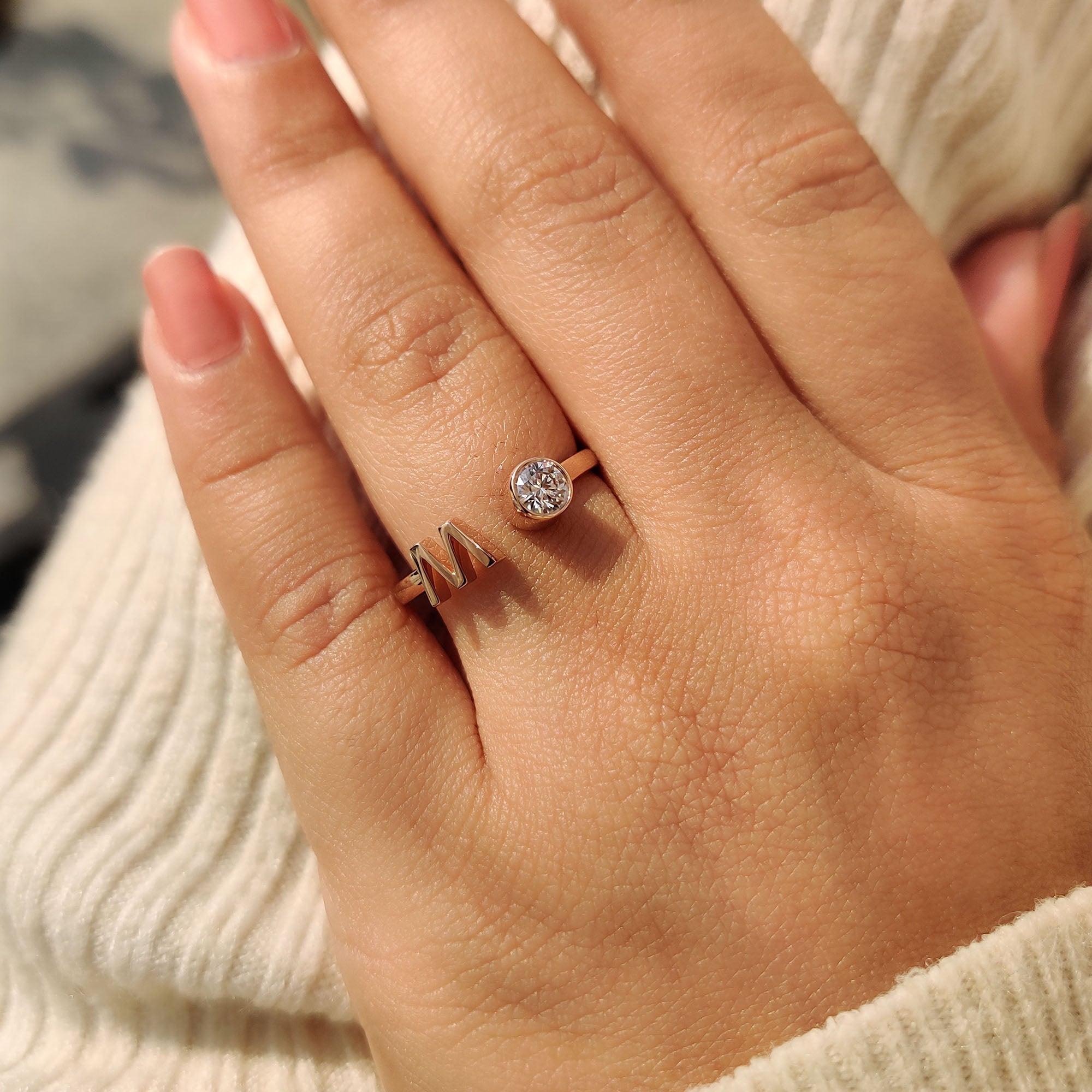 Rose gold ring brings warm tone and soft contrast to the stone.
