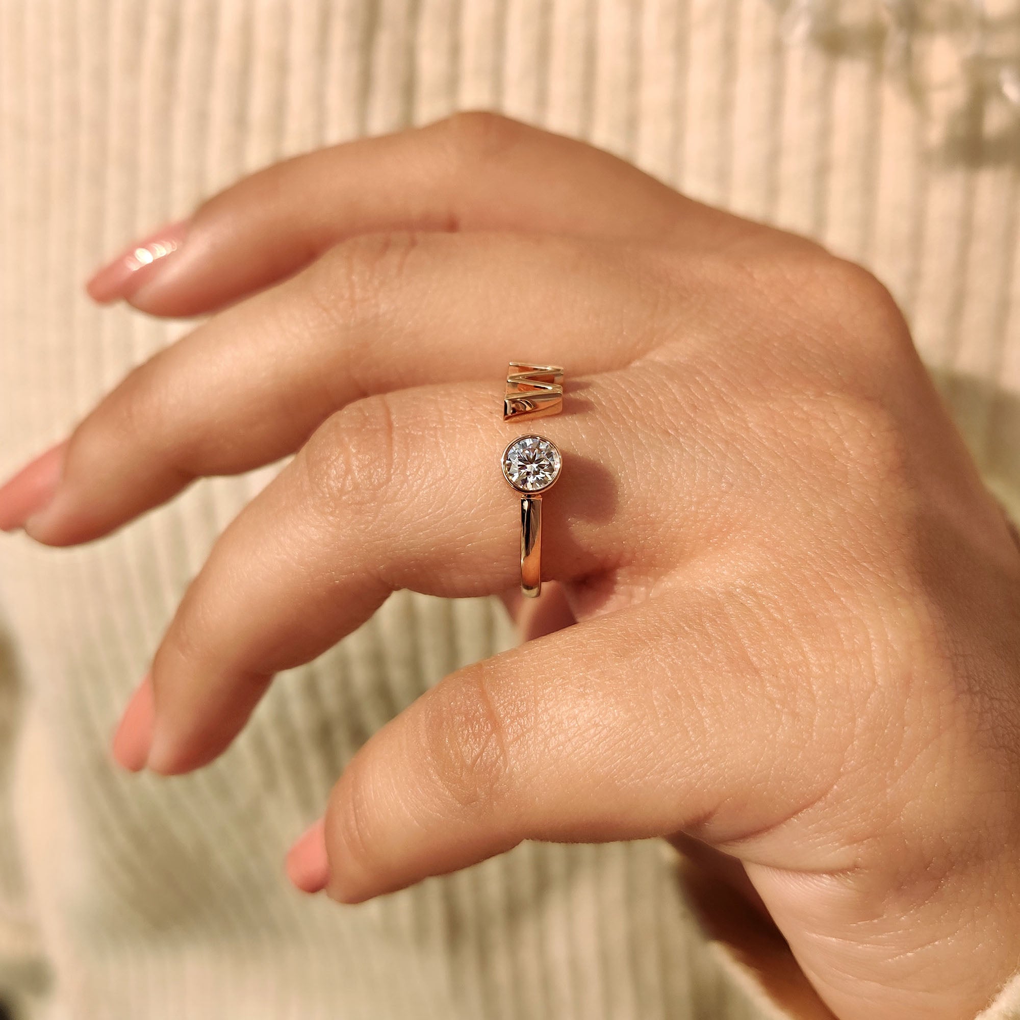 Letter ring includes a personal initial for a custom touch.
