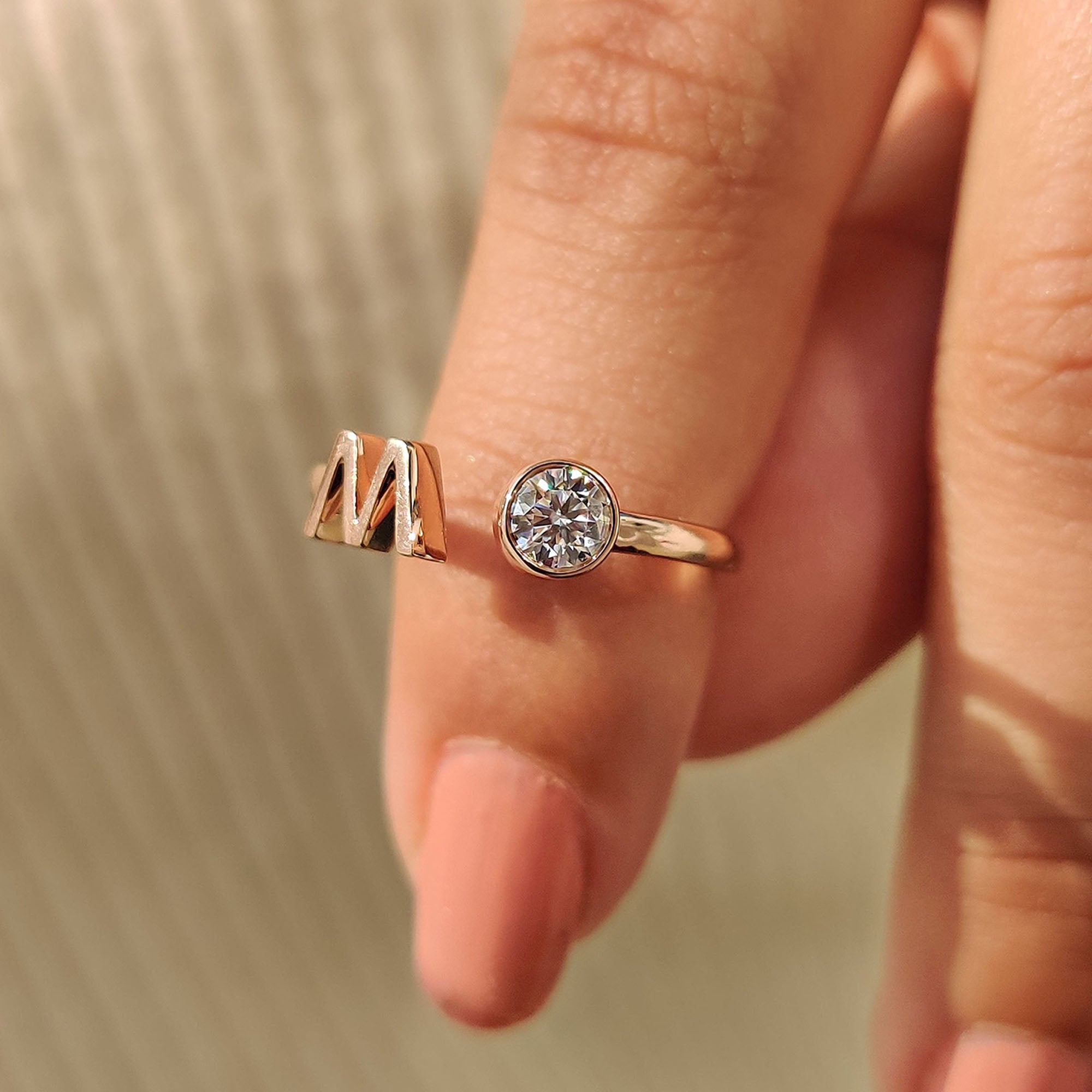Bezel engagement ring has a clean frame that securely holds the stone.
