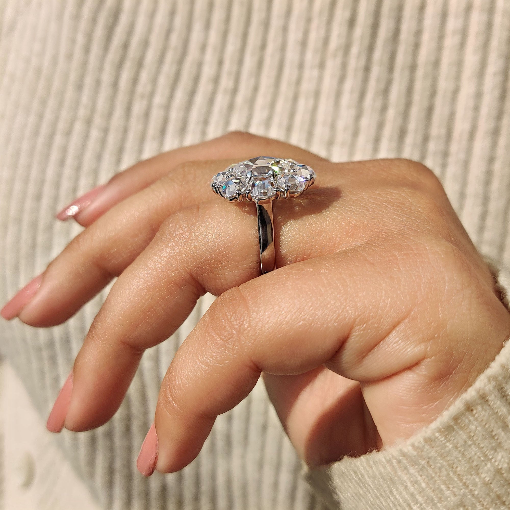 Halo cluster ring built to enhance the center shape with extra gems.
