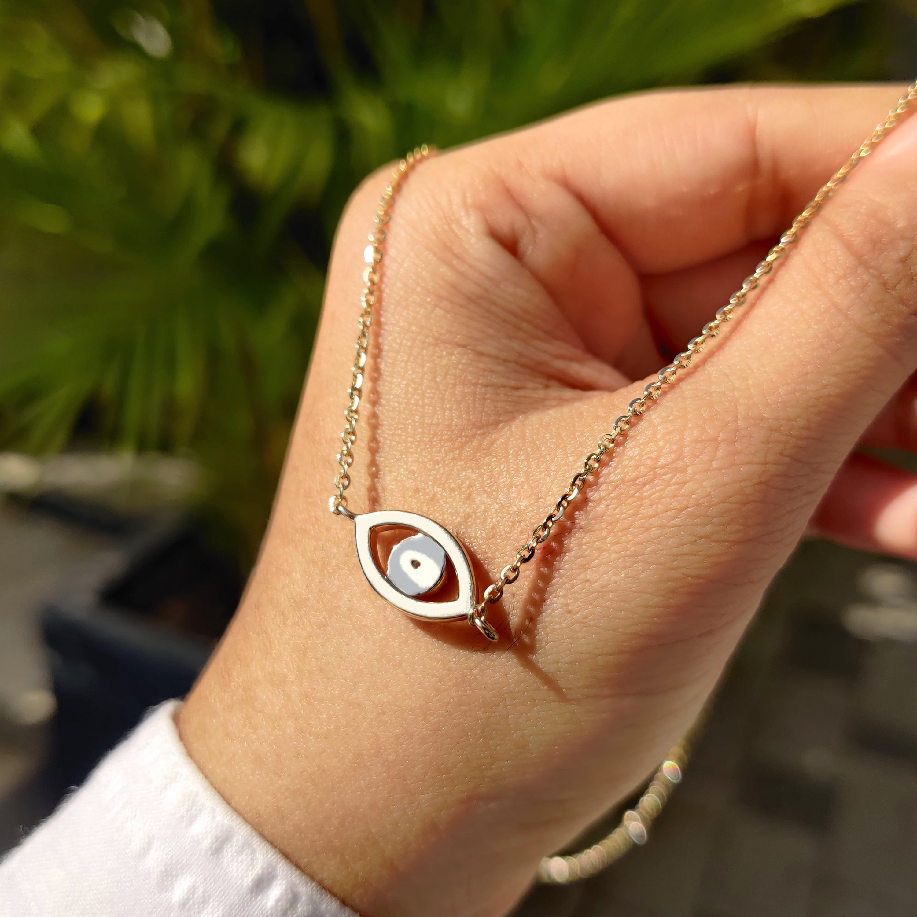 Round diamond pendant set in yellow gold for a classic look.