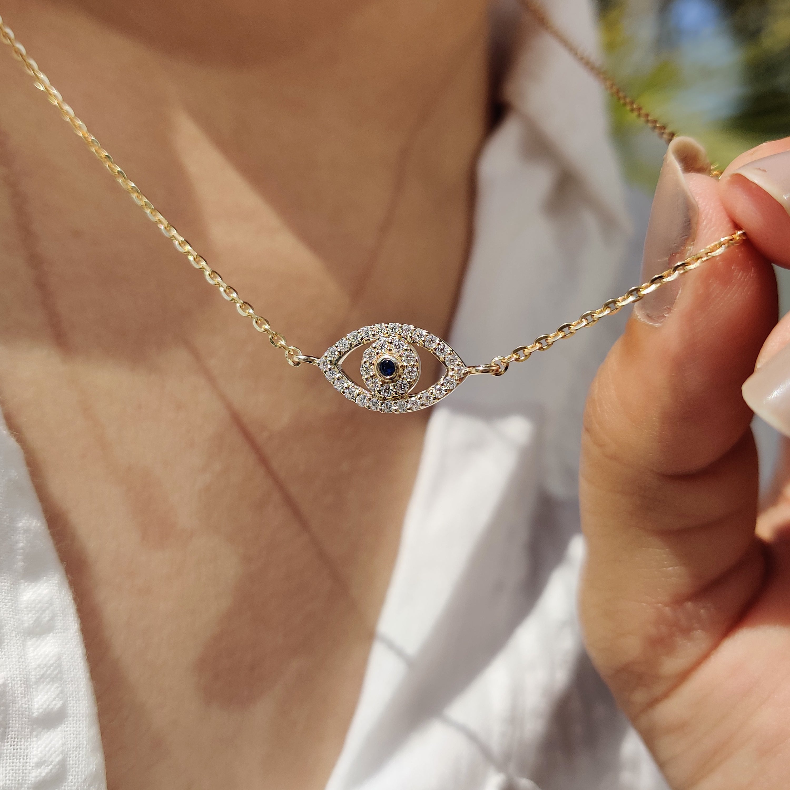 Handmade pendant with a blue diamond, perfect for any occasion.