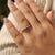 Full eternity band with diamonds encircling the entire ring.
