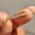 Yellow gold eternity band with a sleek and modern design.
