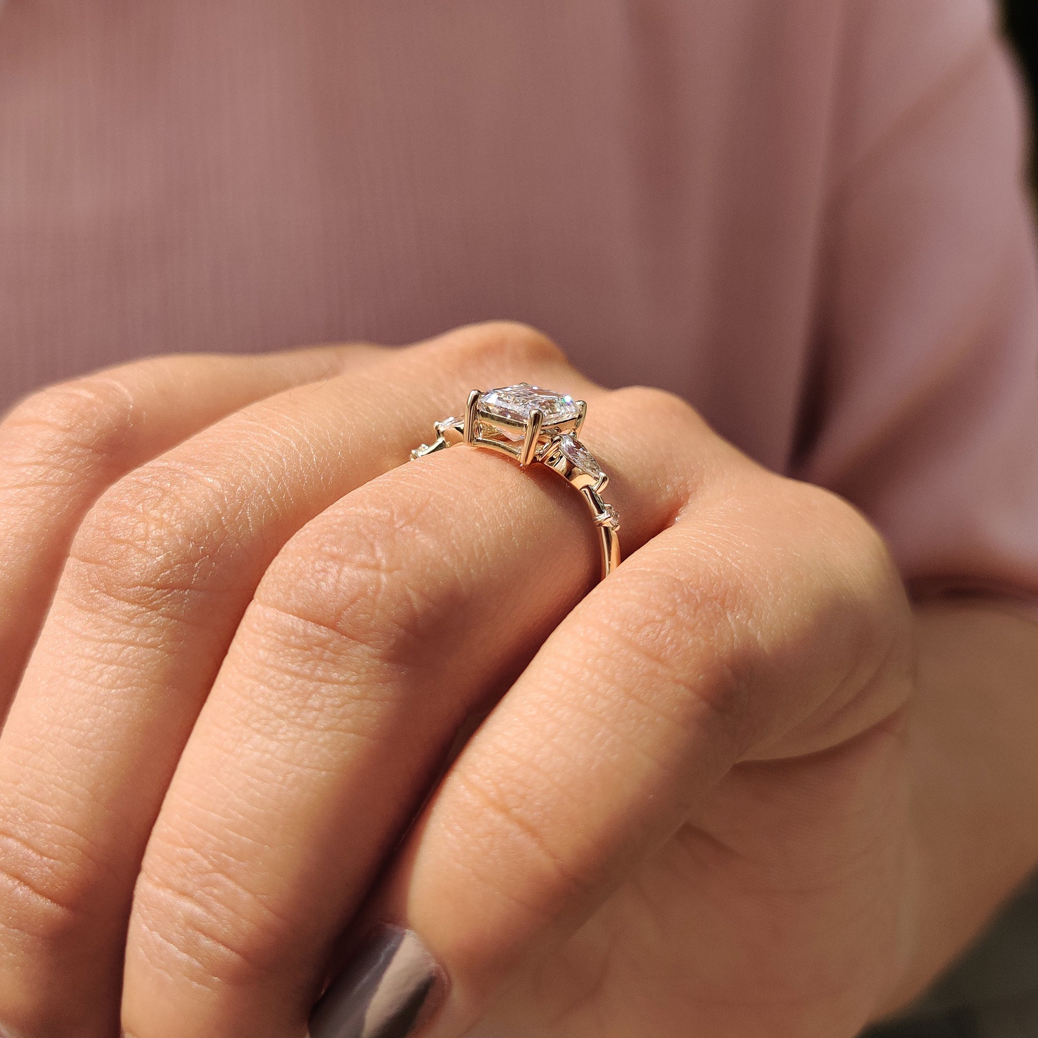 Custom engagement ring with five lab grown diamonds.
