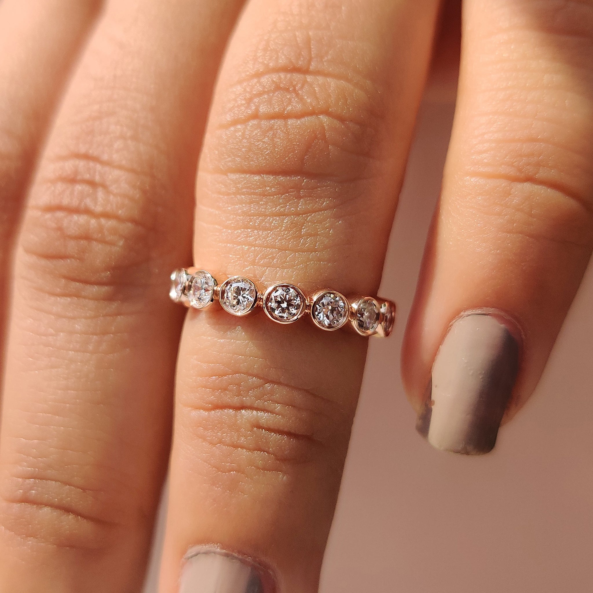 Buy wedding band with bezel setting design.
