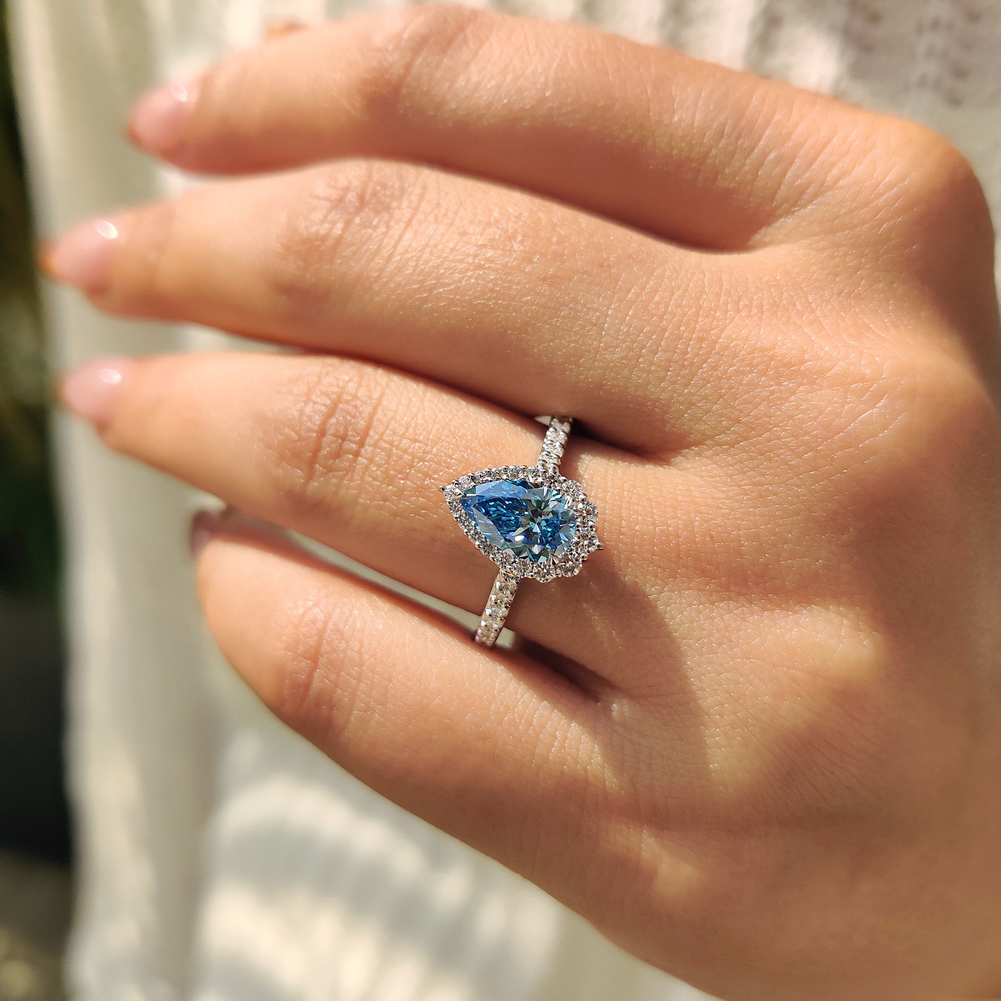 The cyan blue diamond ring offers a bold pop of color and elegance.