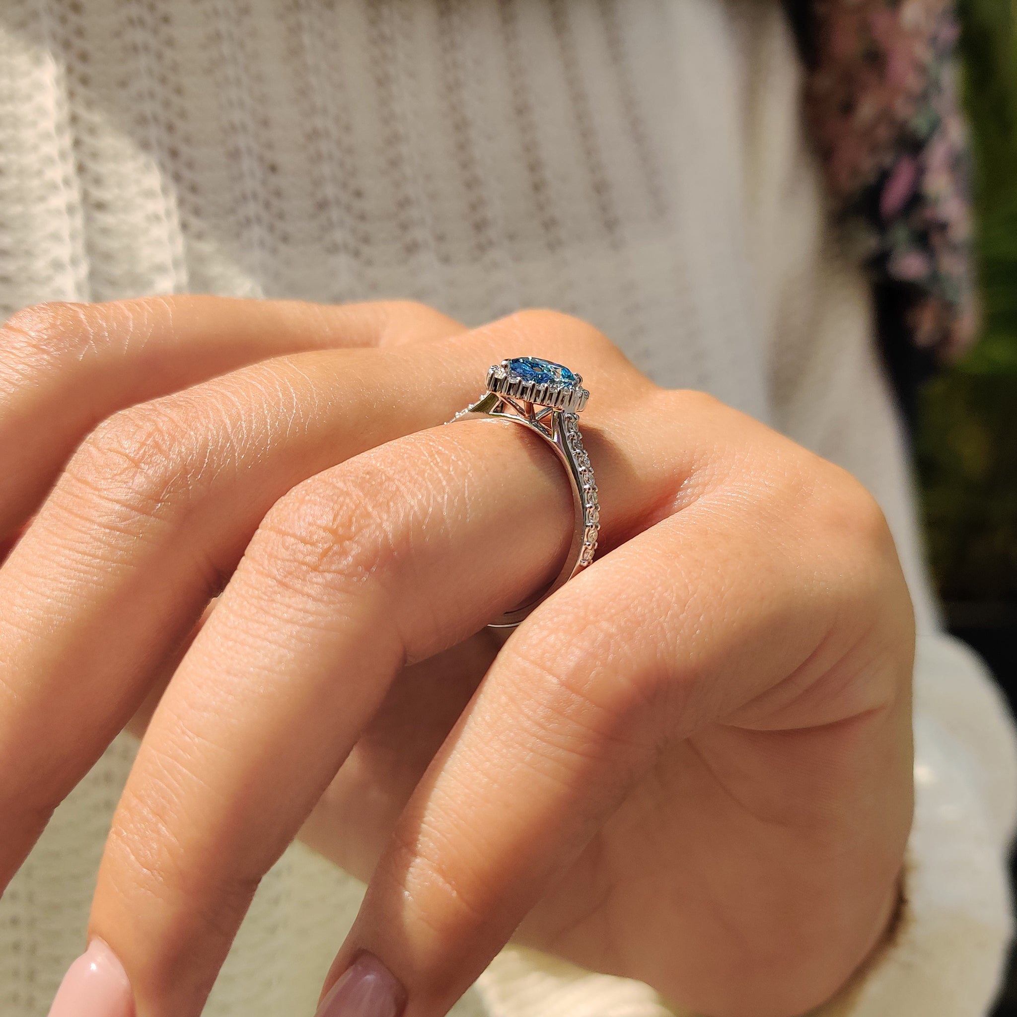 Cathedral setting ring elevates the pear diamond for extra shine.