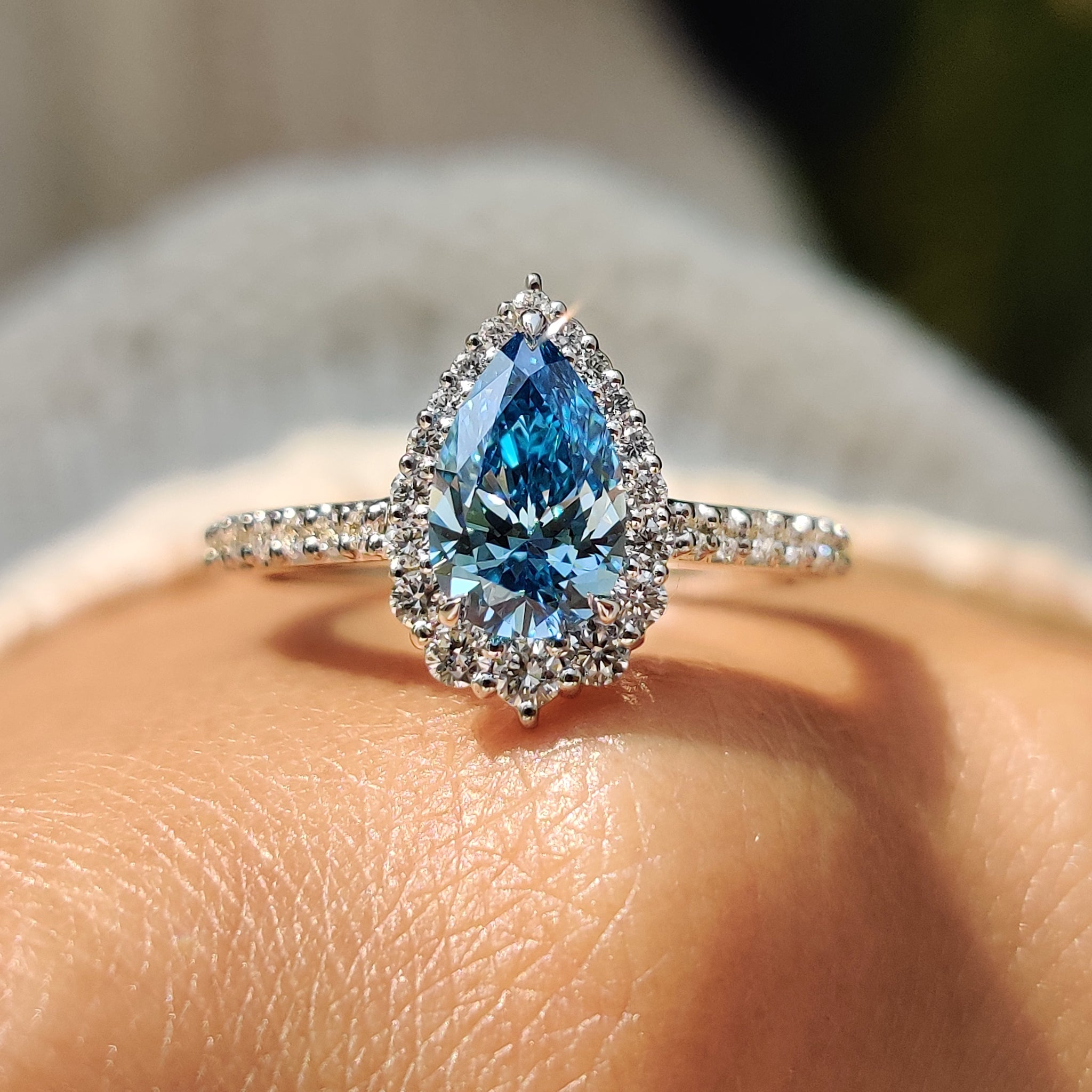 This pear diamond ring features a unique, elegant shape.