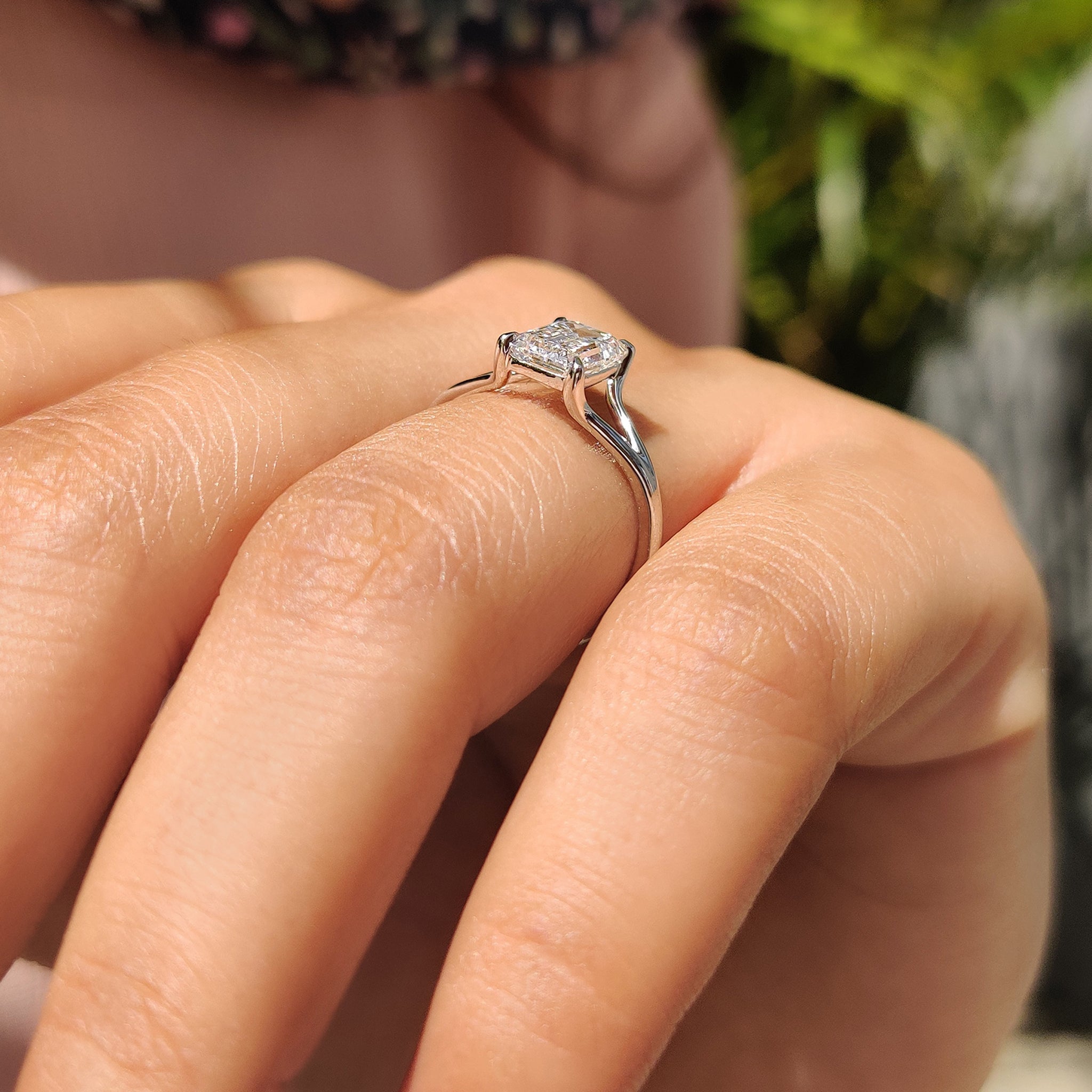 Handmade ring with a stunning emerald cut lab-grown diamond, set in white gold, designed with a split shank for extra elegance.
