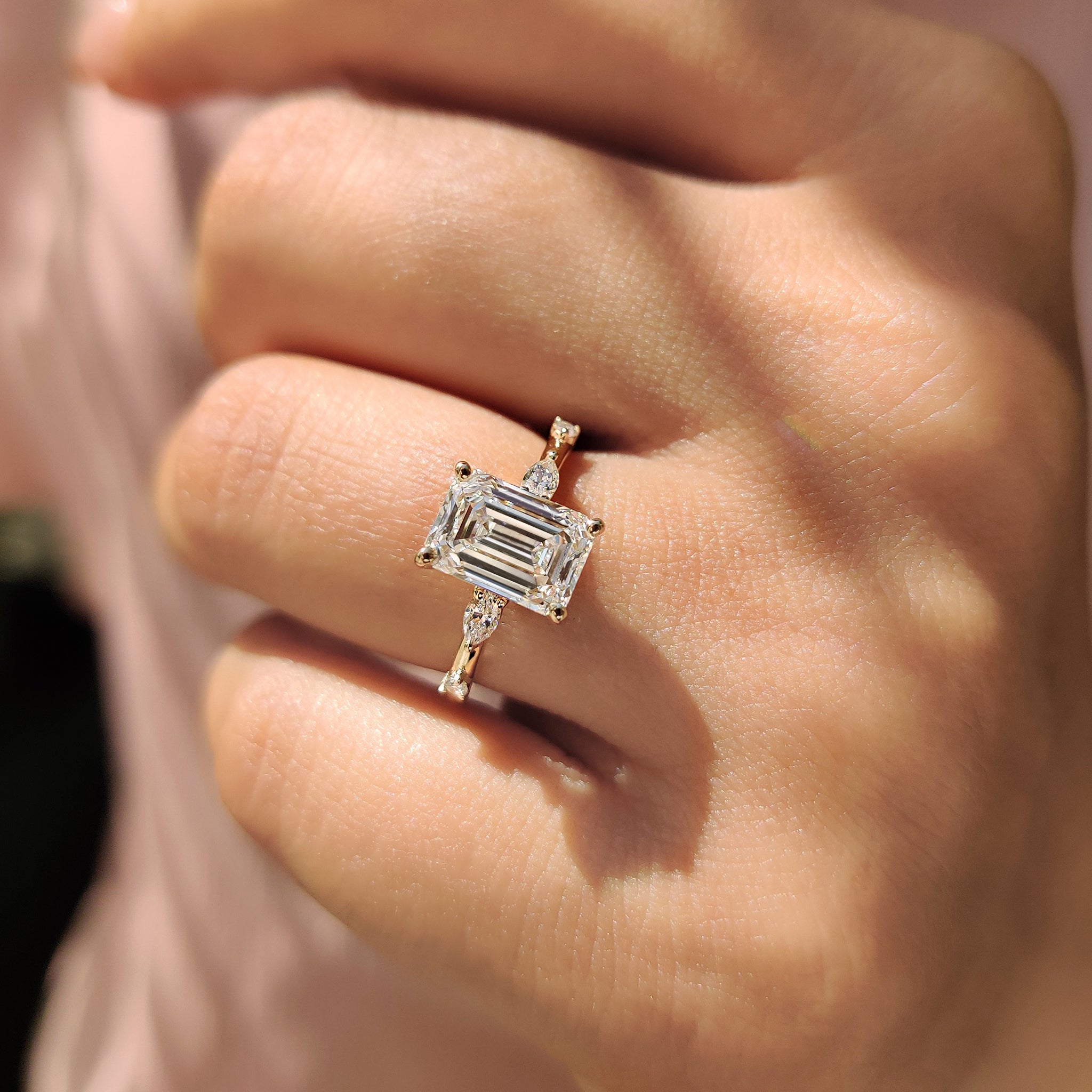 Elegant marquise and round cut ring in yellow gold, designed with Lab Grown Diamond stones and a unique distance pave setting ring.
