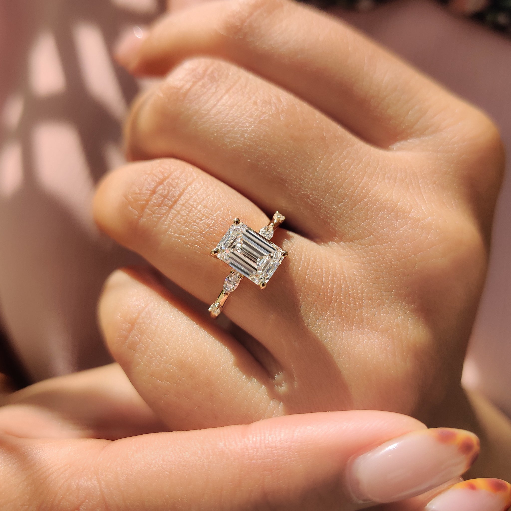 Handmade jewelry crafted with a yellow gold ring showcasing Lab Grown Diamond stones in a marquise and round cut design.

