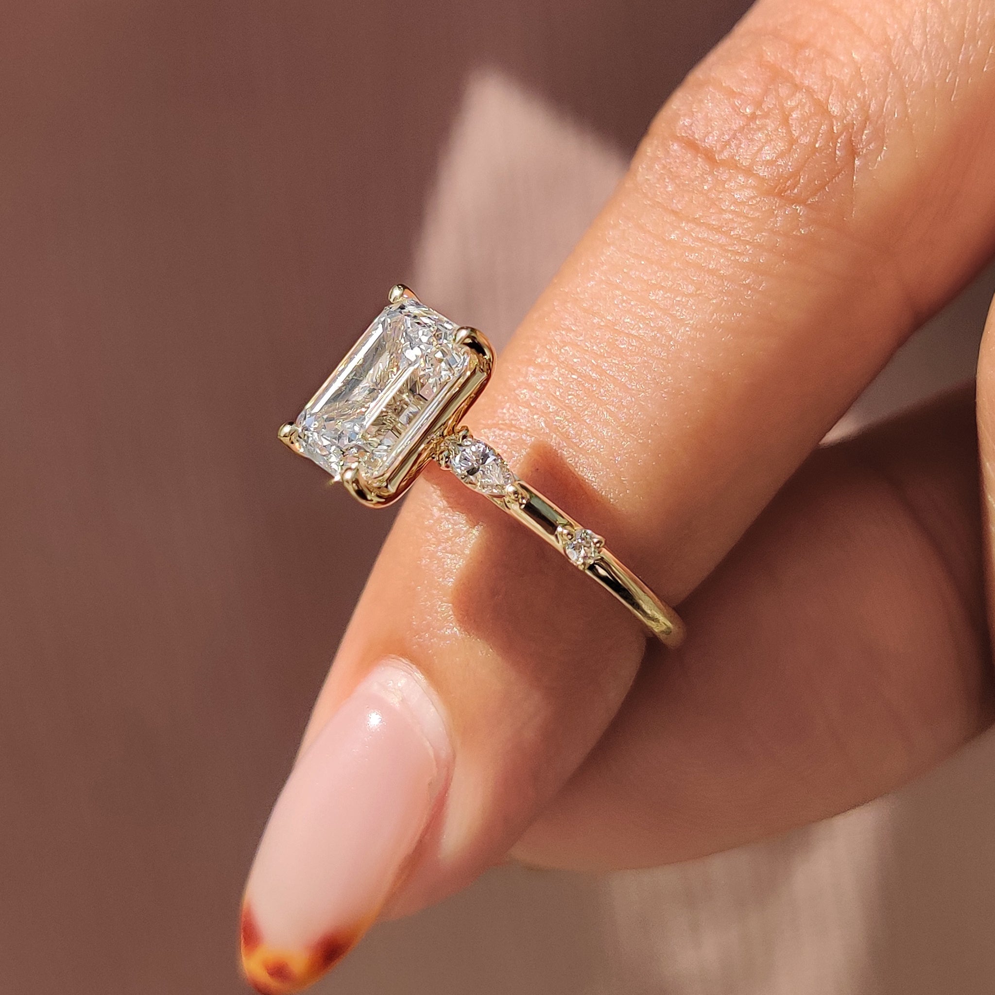 A beautiful Lab Grown Diamond set in yellow gold ring, with a distance pave setting ring design and IGI certification.

