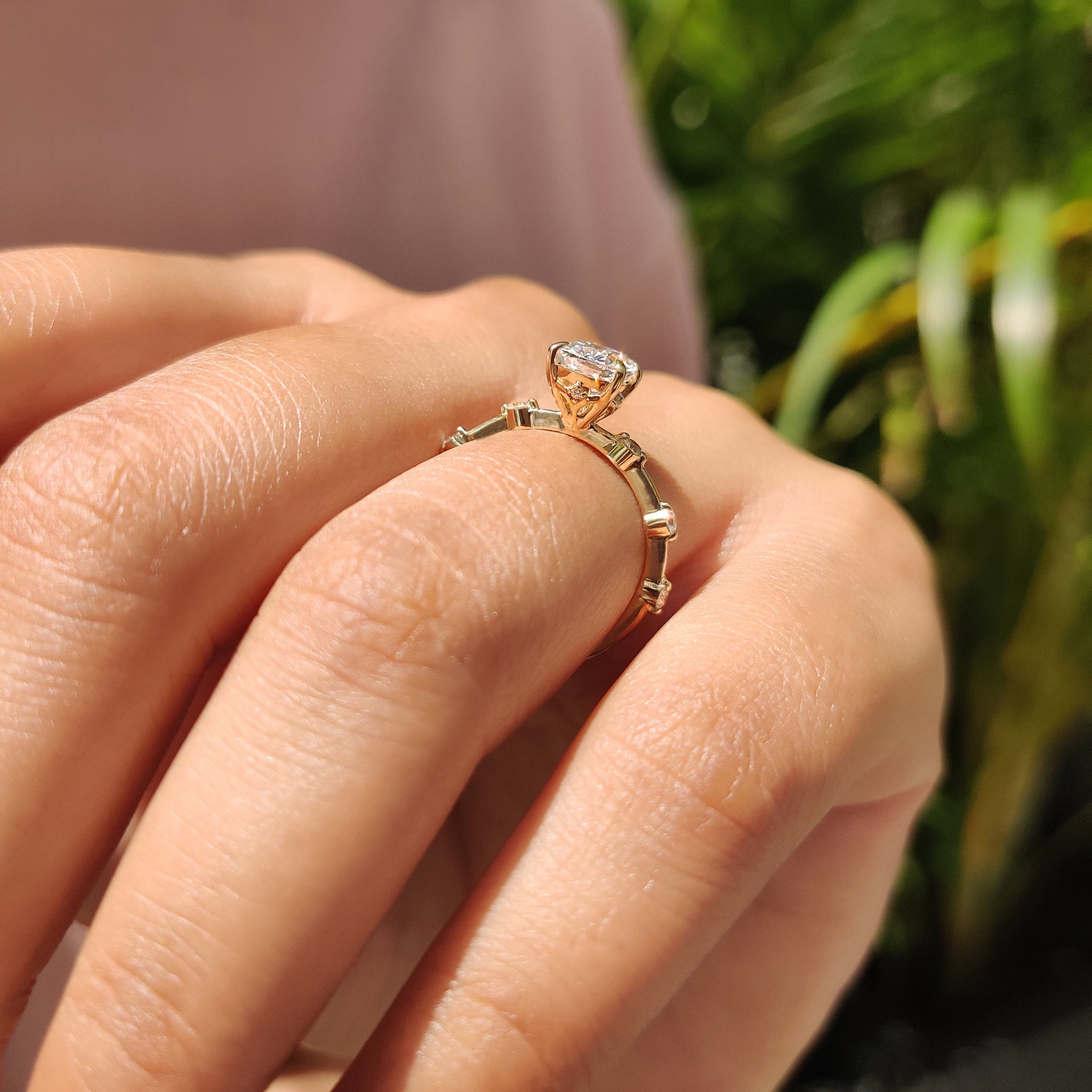 Handmade jewelry featuring a Seven Stone Diamond Ring with cushion cut and round cut diamonds.
