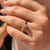 Elegant tapered ring shank design holds a princess cut solitaire diamond in a yellow gold setting.
