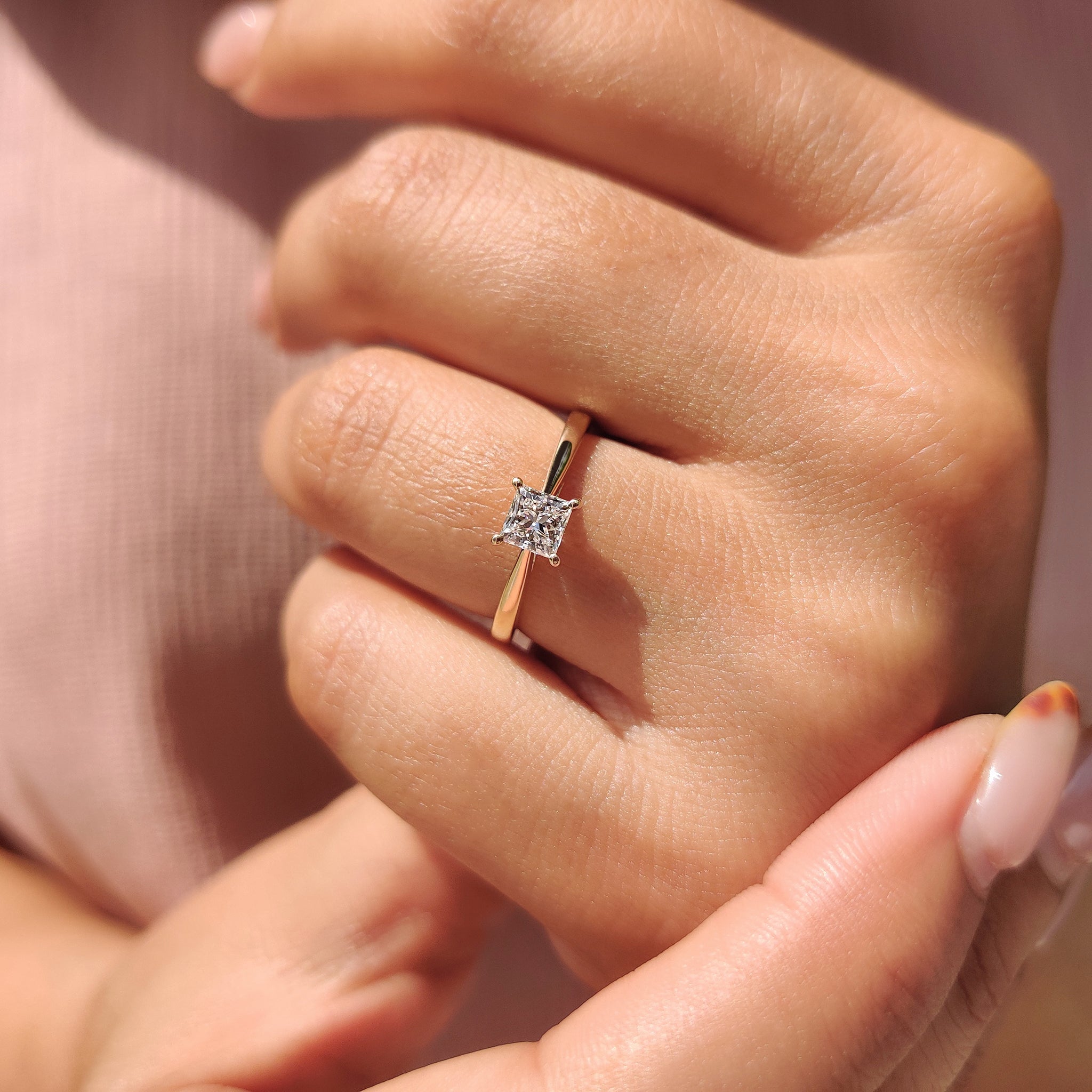 Lab-grown diamond princess cut solitaire ring, featuring an IGI certified diamond set in a 4 prong ring.

