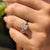 Handmade ring with a radiant cut diamond and marquise side stones, set in yellow gold.
