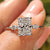 Radiant Cut Diamond Ring with marquise side stones in a yellow gold setting.
