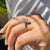 Round and marquise cut ring with a distance pave set design in white gold.
