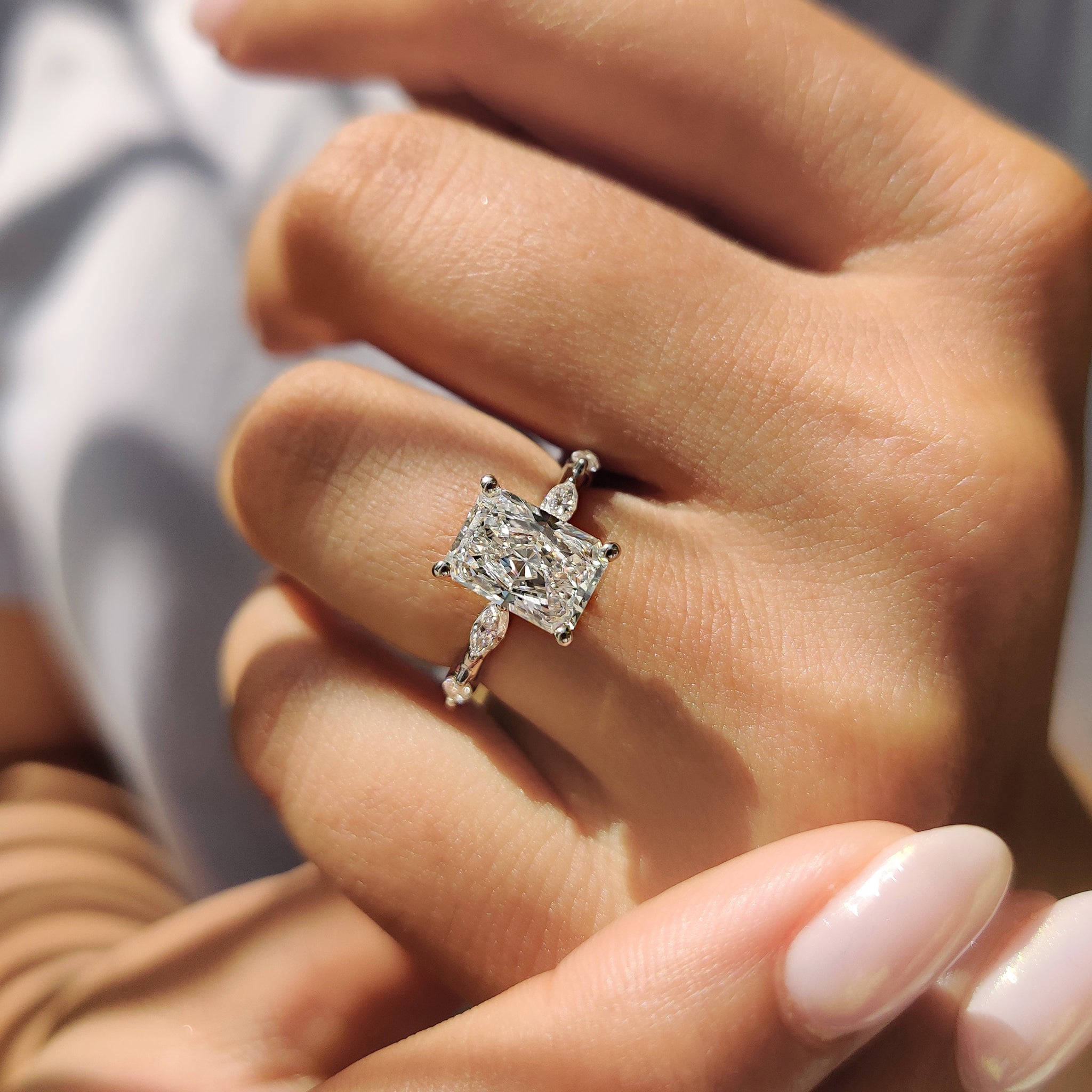 Handmade ring showcasing a radiant cut Lab Grown Diamond in a white gold setting.
