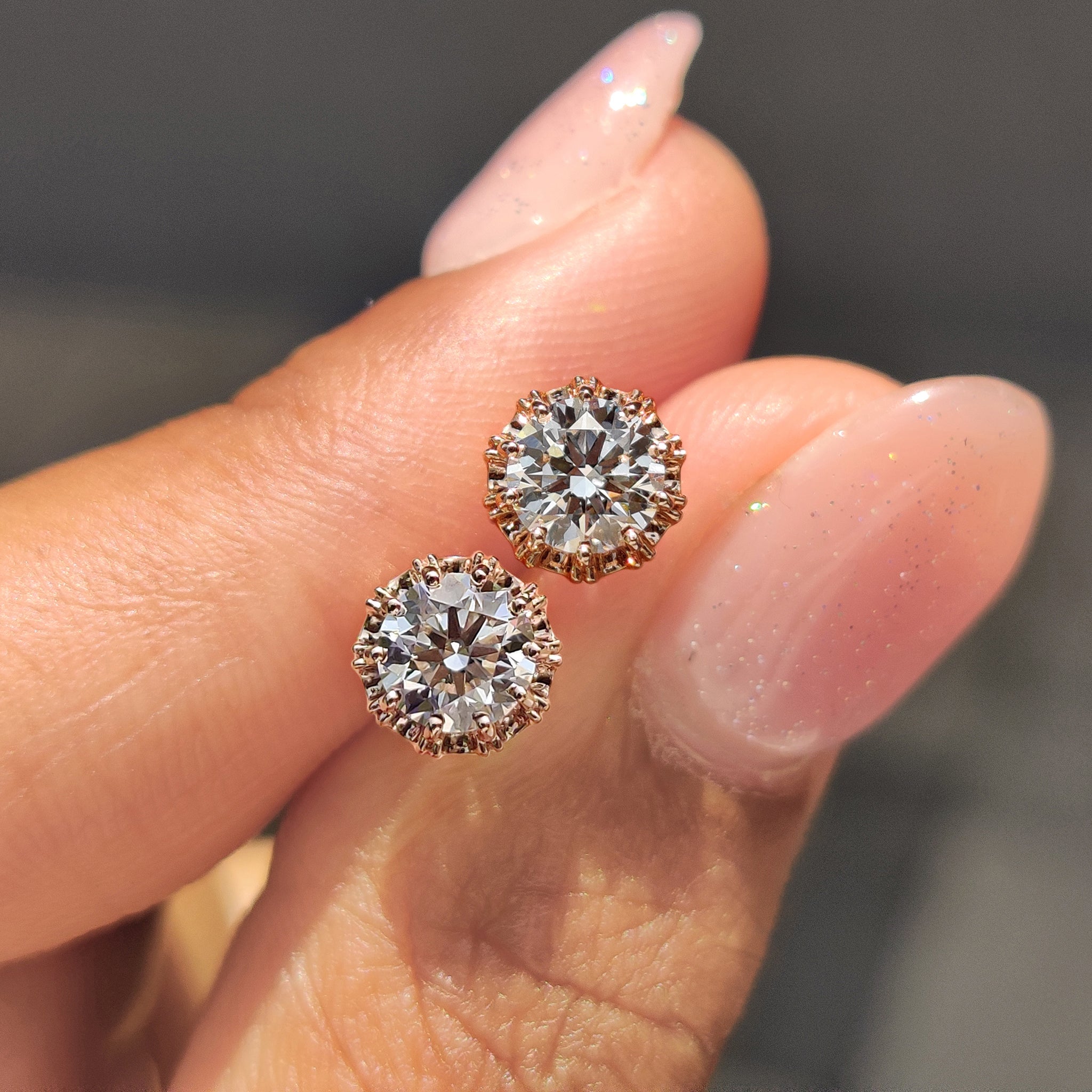 Diamond stud earrings with sparkling round diamonds.