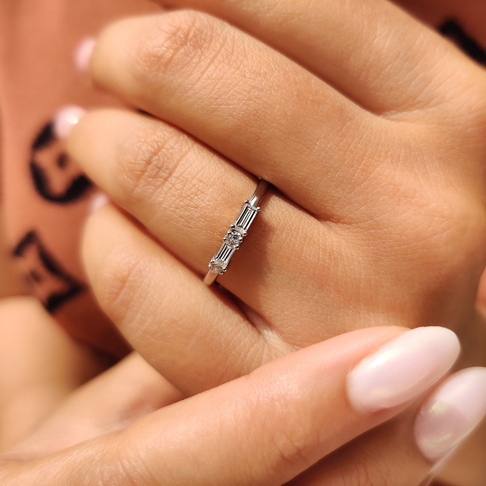 Classic round cut wedding band with brilliant diamond accents in white gold.
