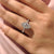 Halo setting ring with cathedral design.
