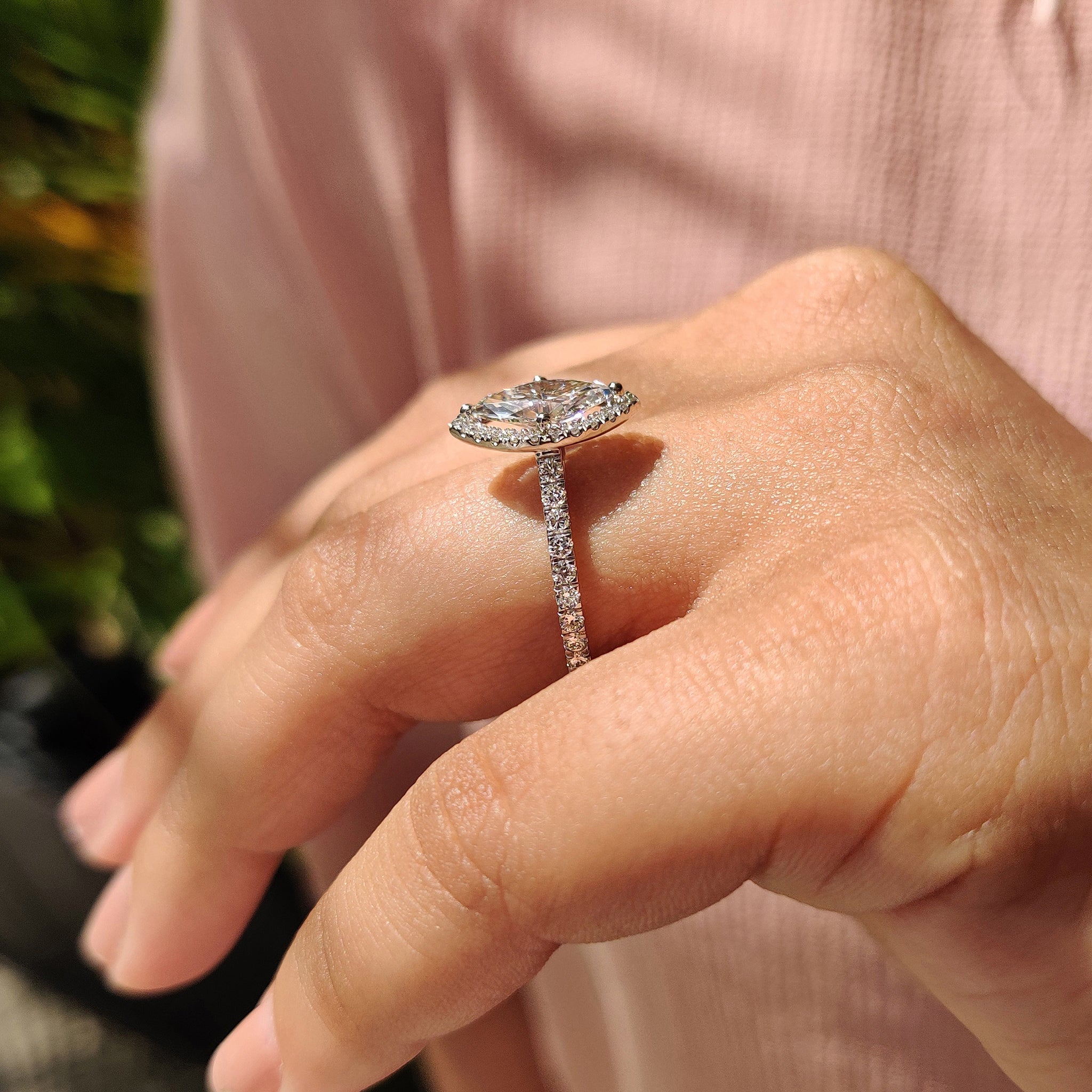 Round cut halo pave setting in white gold.
