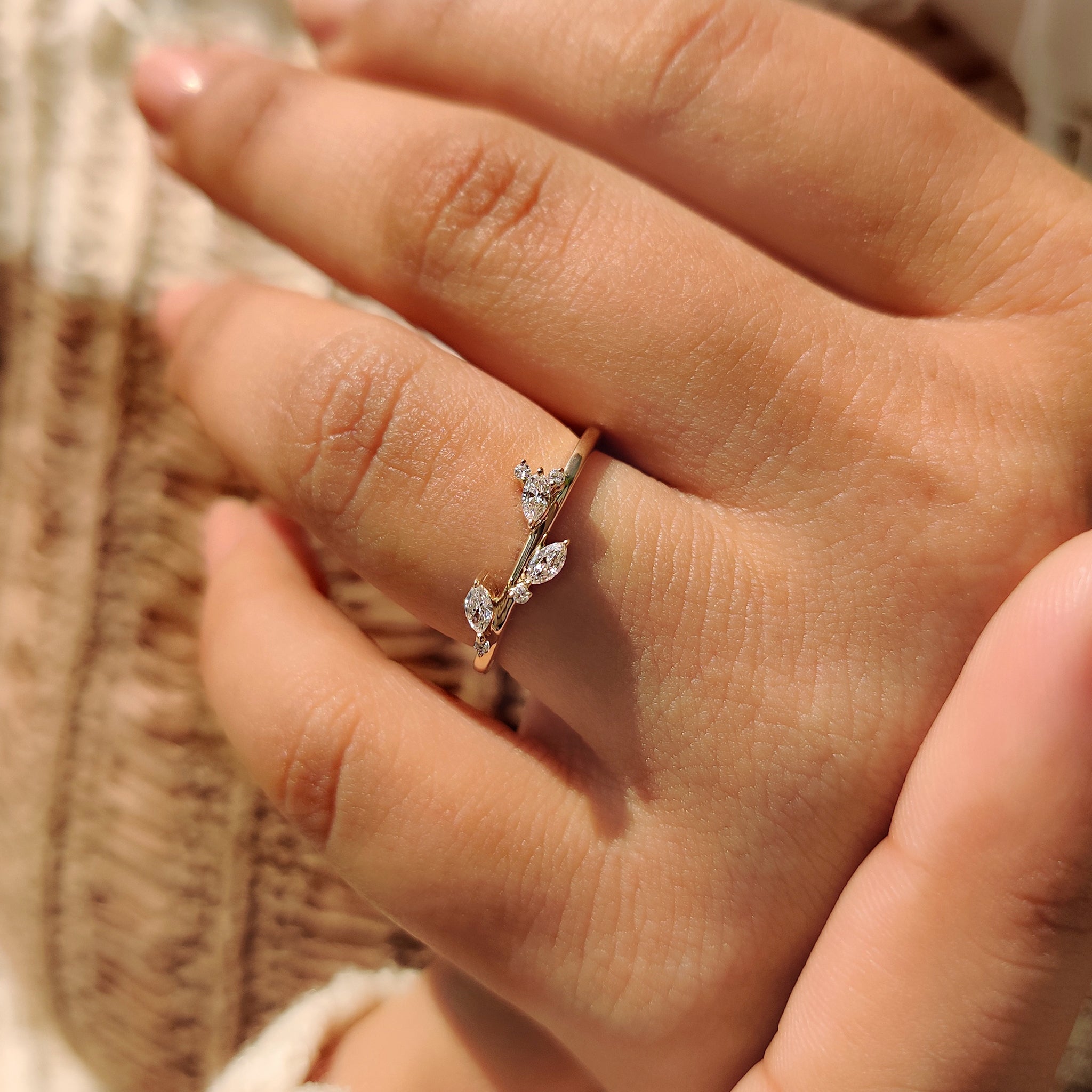 Handmade band with marquise and round diamonds in a yellow gold.