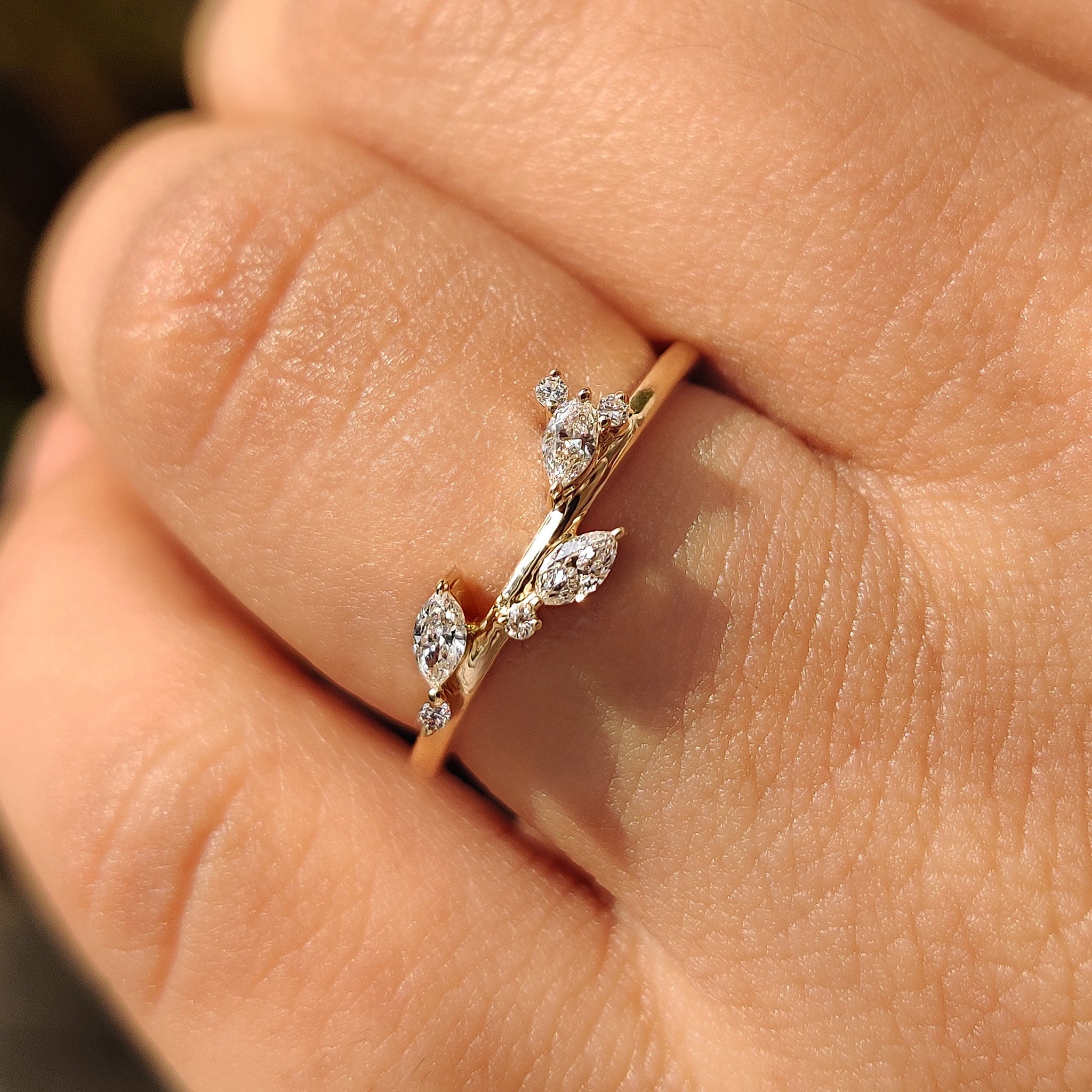 Classic wedding ring featuring marquise and round diamond design.