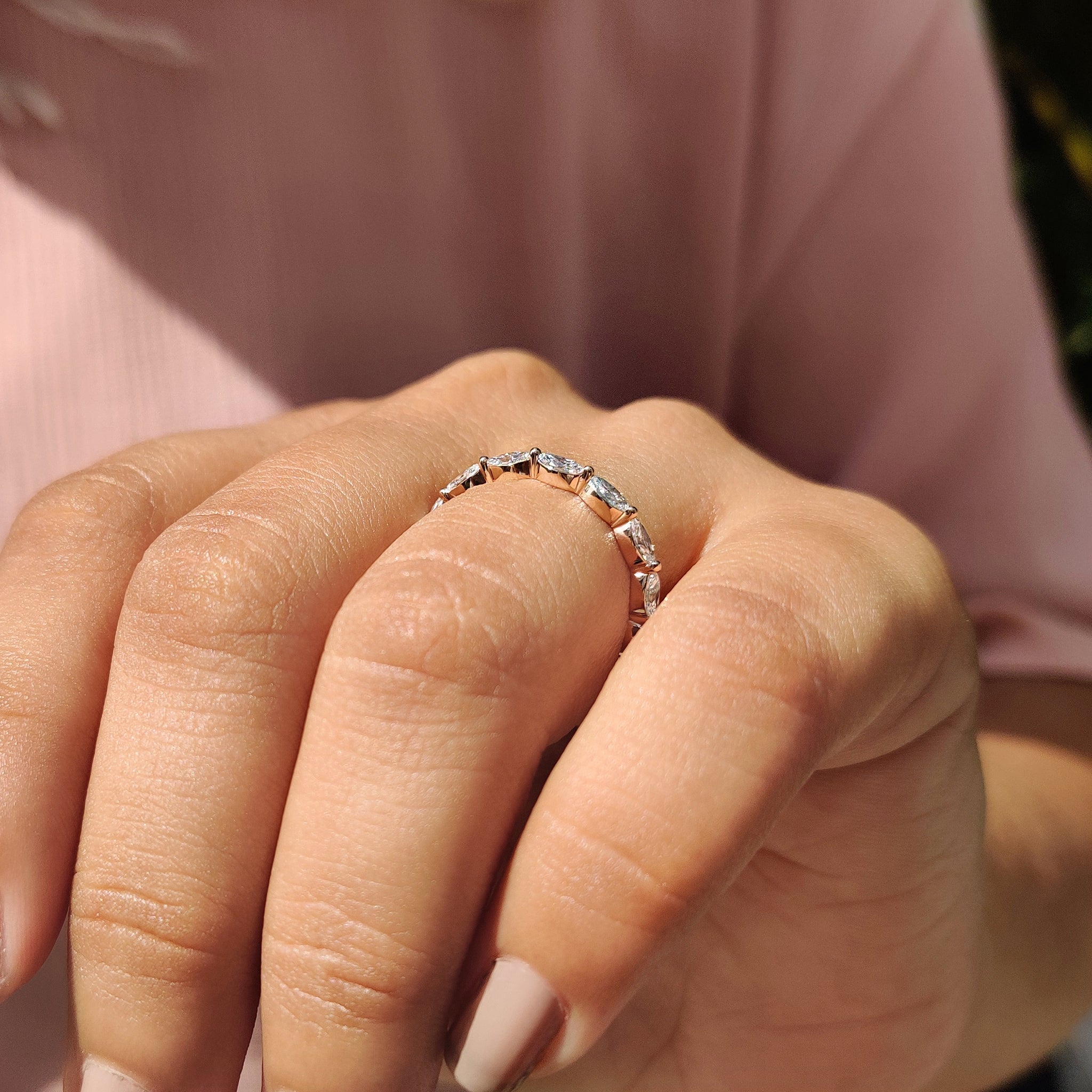 Custom wedding band with marquise diamond full eternity design in rose gold.
