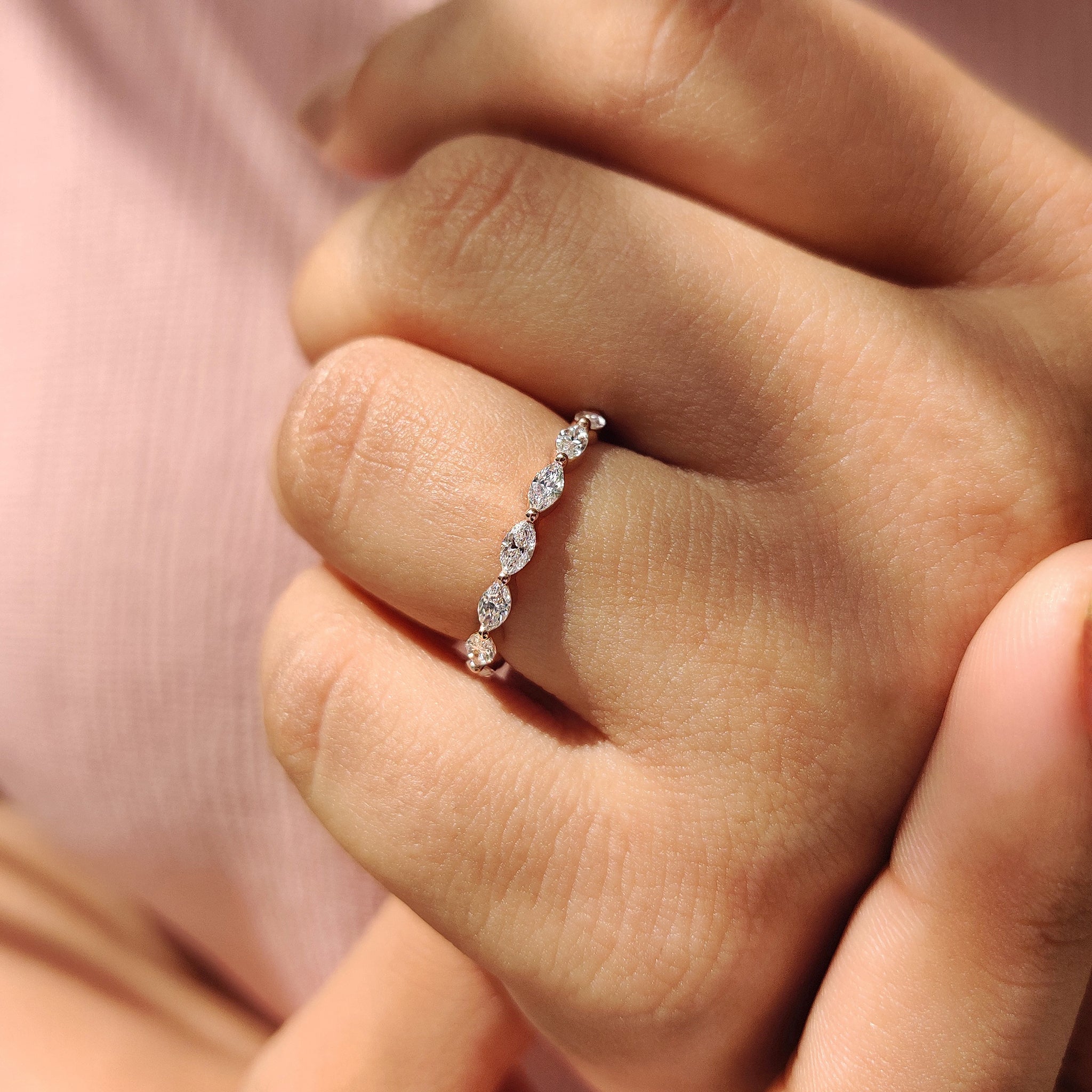 Full eternity diamond wedding band with carat diamonds band in rose gold.