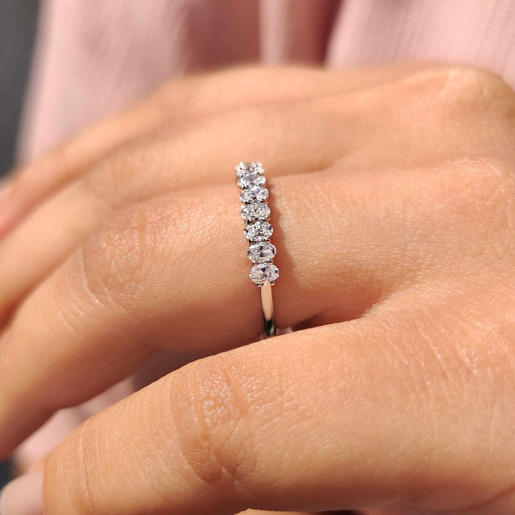 Oval diamond band designed as a semi eternity diamond wedding band.
