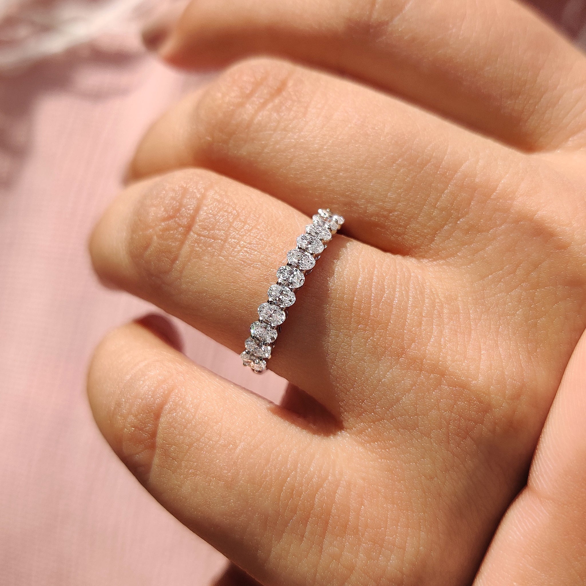 Buy wedding band with oval diamond semi eternity design for a promise band.
