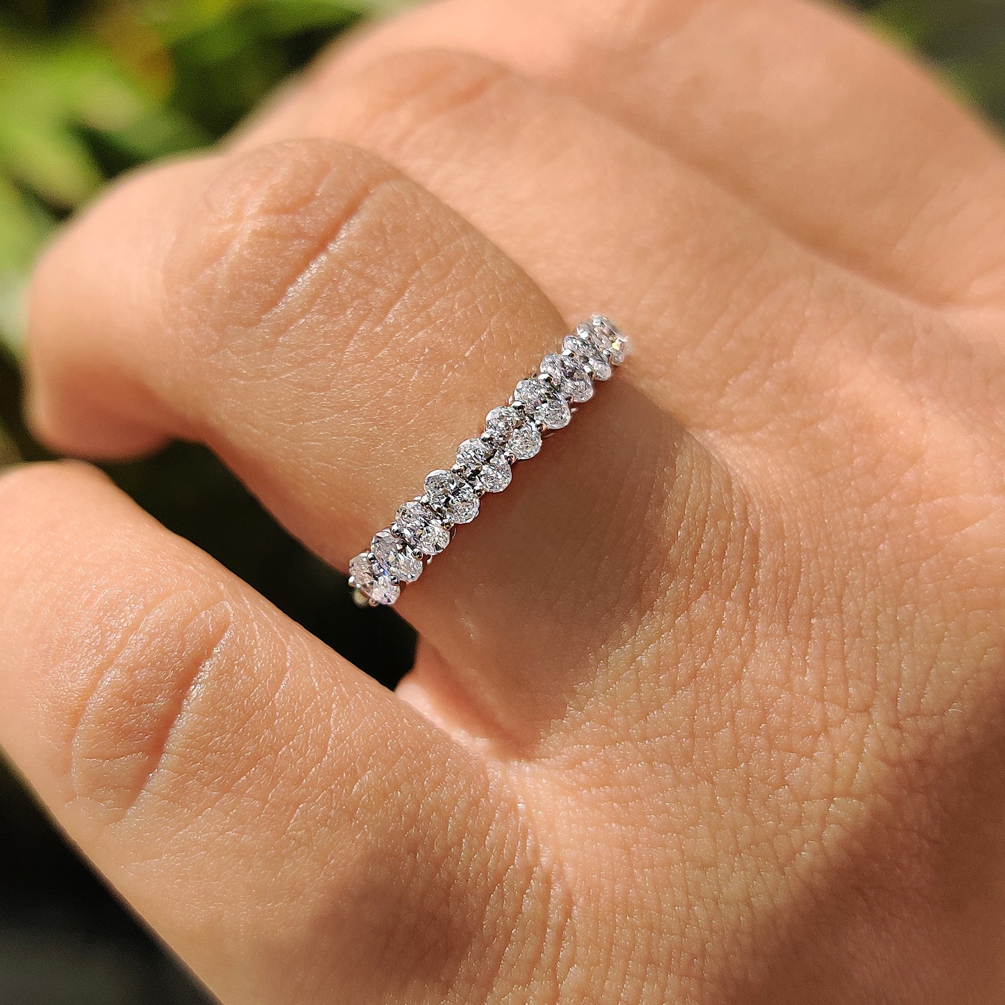 Promise band featuring oval diamond band and custom wedding band design.