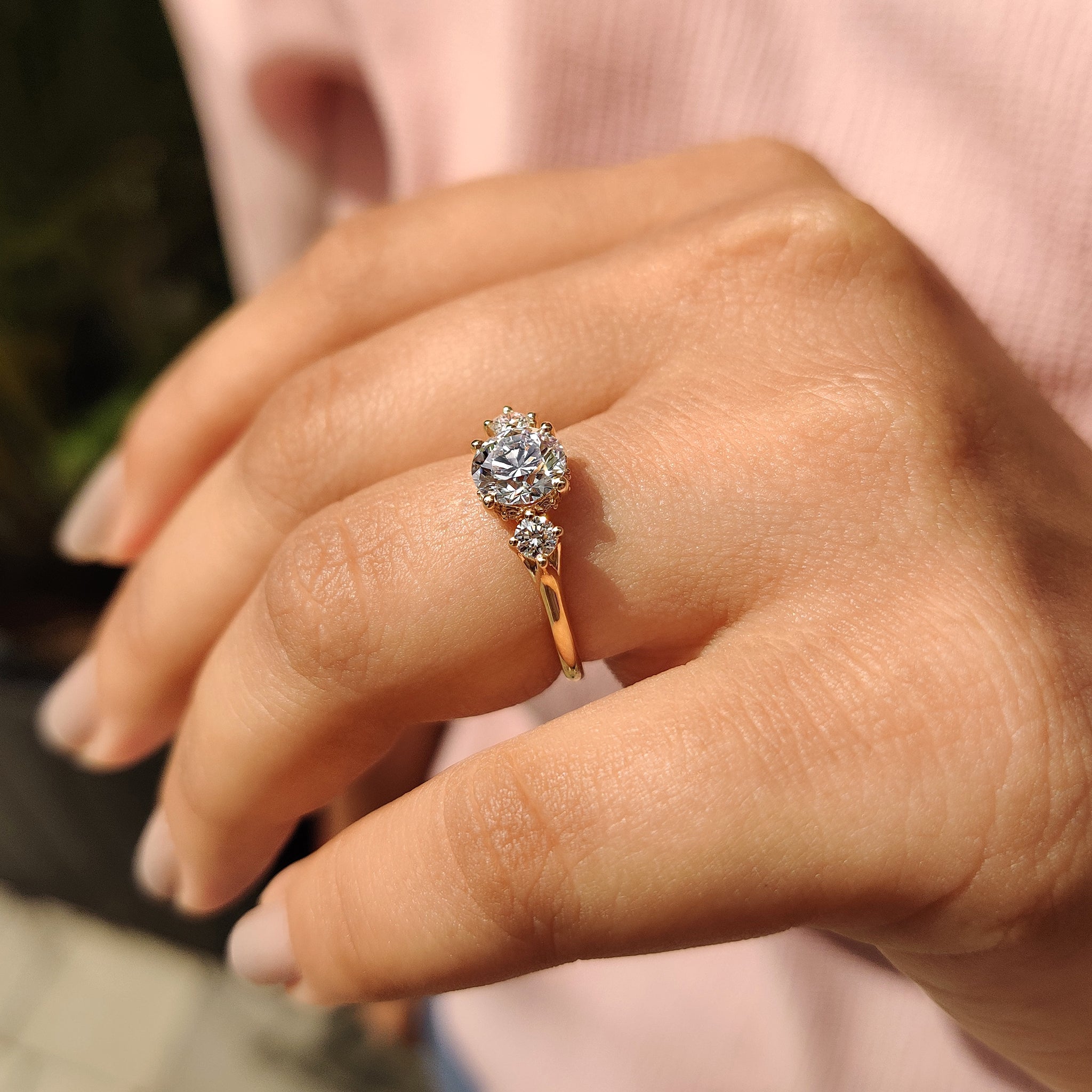 IGI certified lab grown diamond set in a three stone engagement ring.