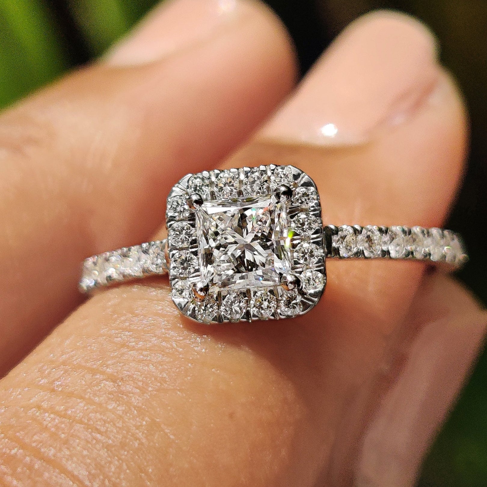 Halo princess cut engagement ring with princess cut diamond center.
