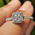 Halo princess cut engagement ring with princess cut diamond center.
