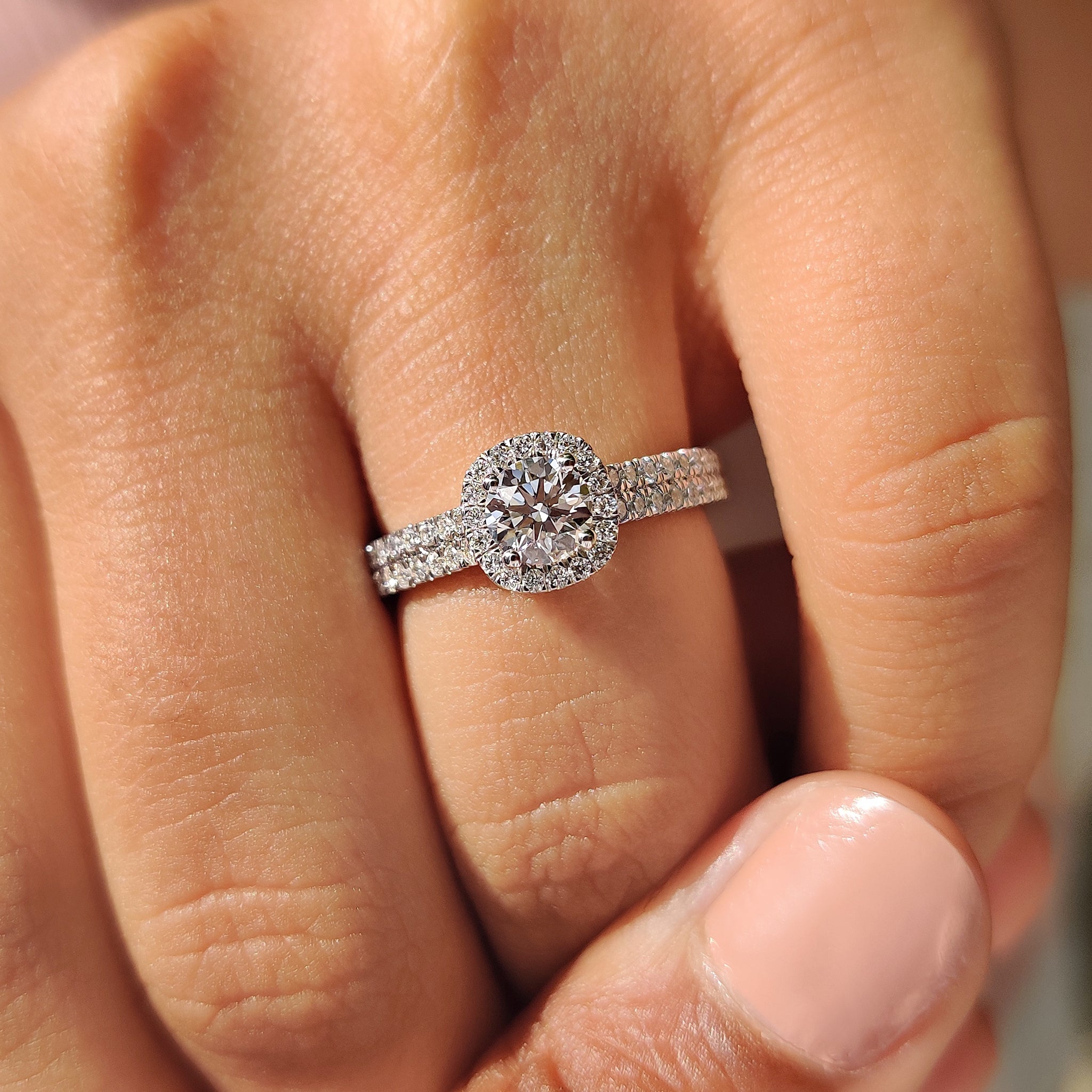 White gold engagement ring with double row pave band.
