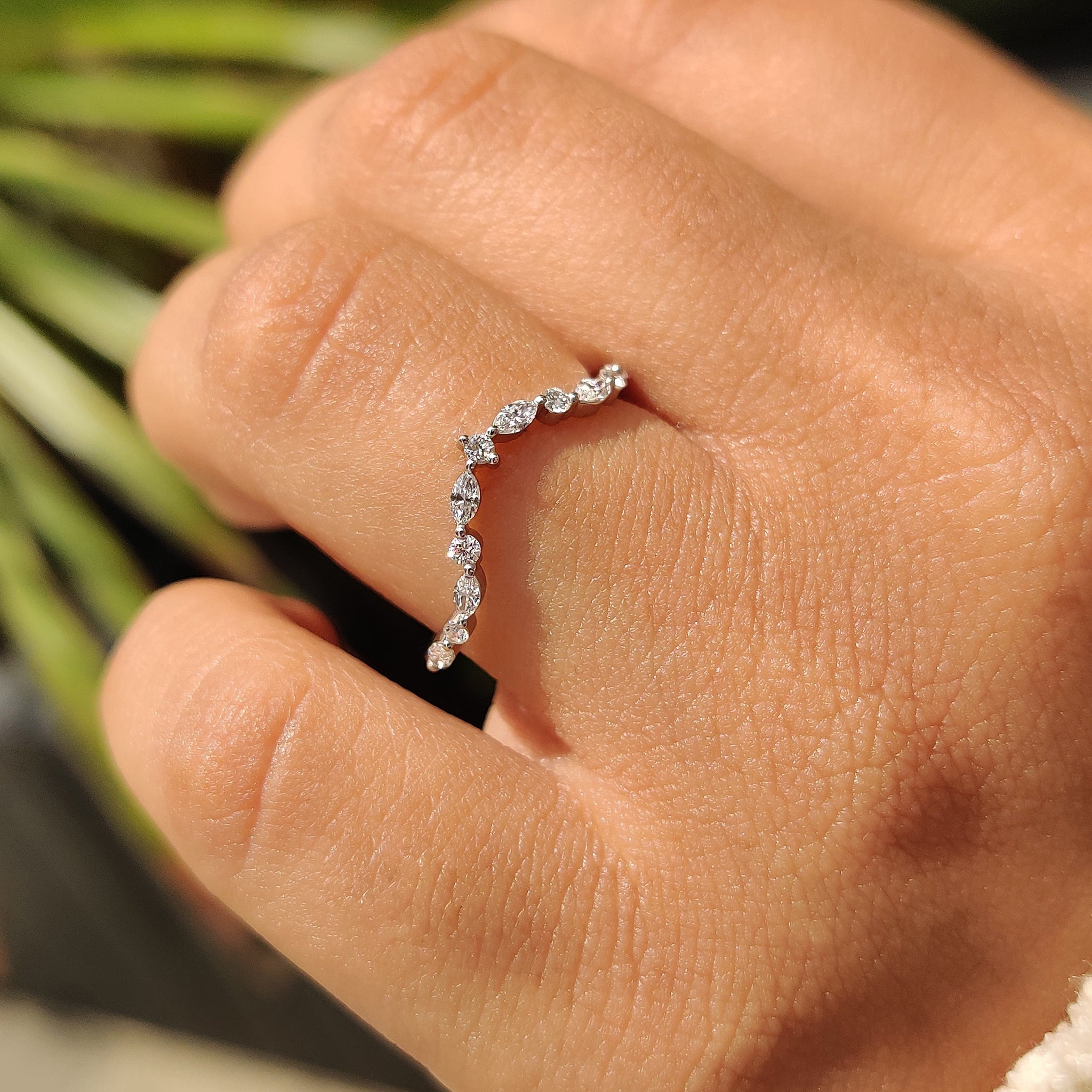 Marquise and round wedding band with half eternity design.
