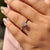 Round cut hidden halo set matched with 4 claw prong.
