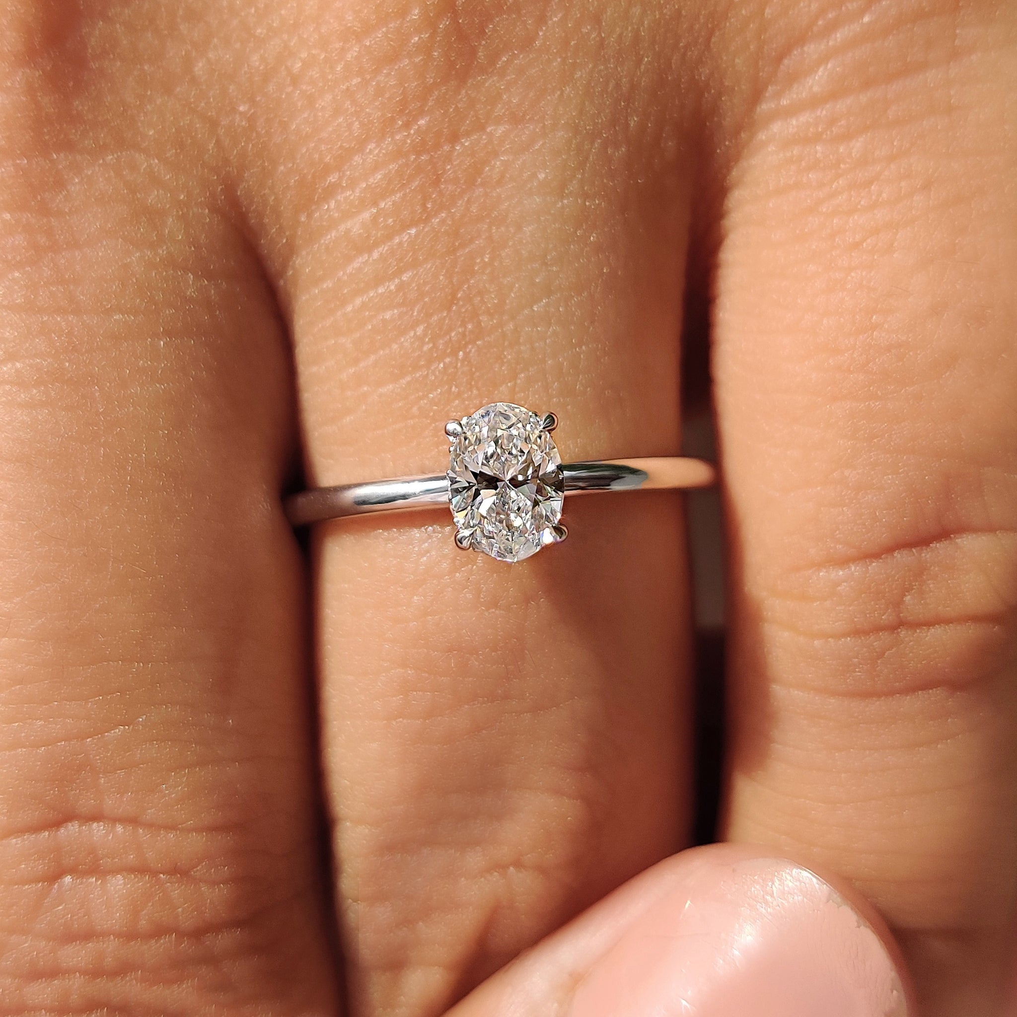 White gold engagement ring with oval cut engagement ring.
