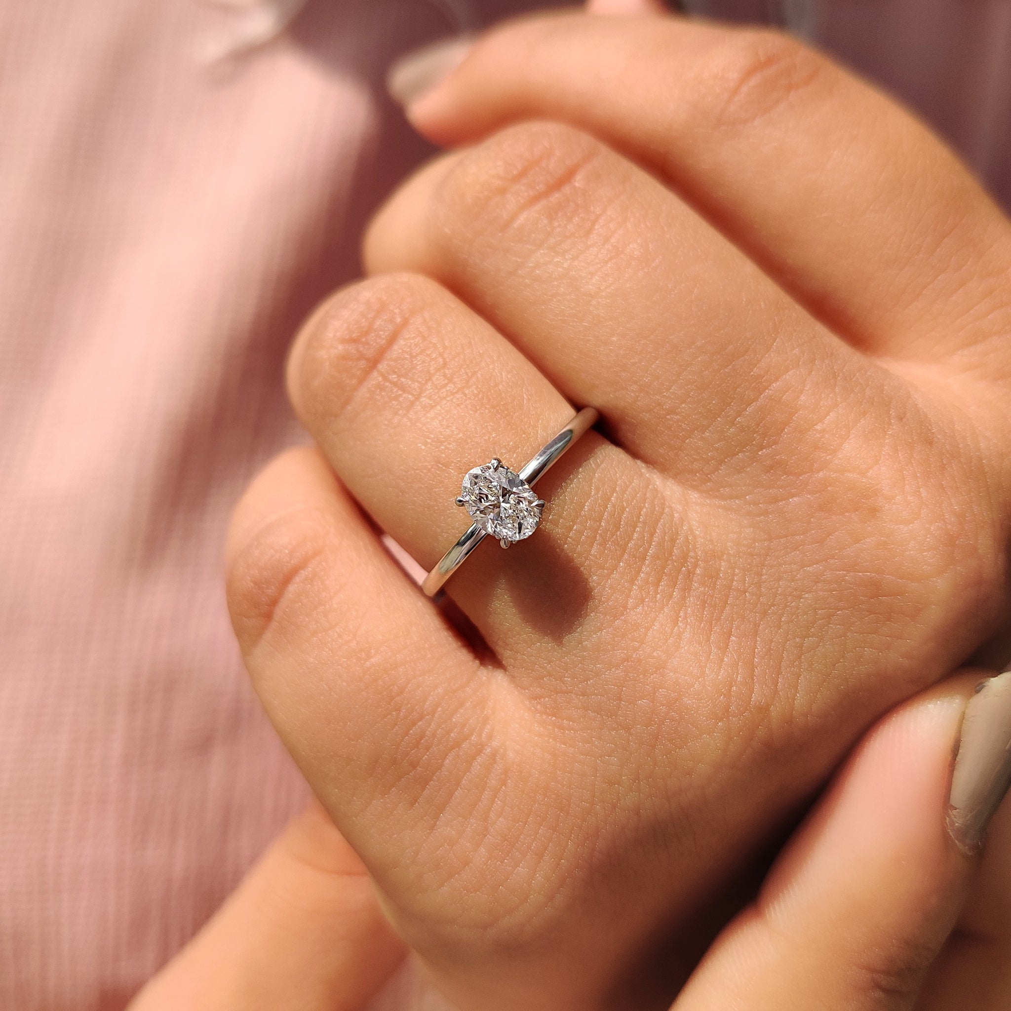 Hidden halo engagement ring with round cut hidden halo set.
