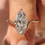 Marquise cut engagement ring with compass prong setting.
