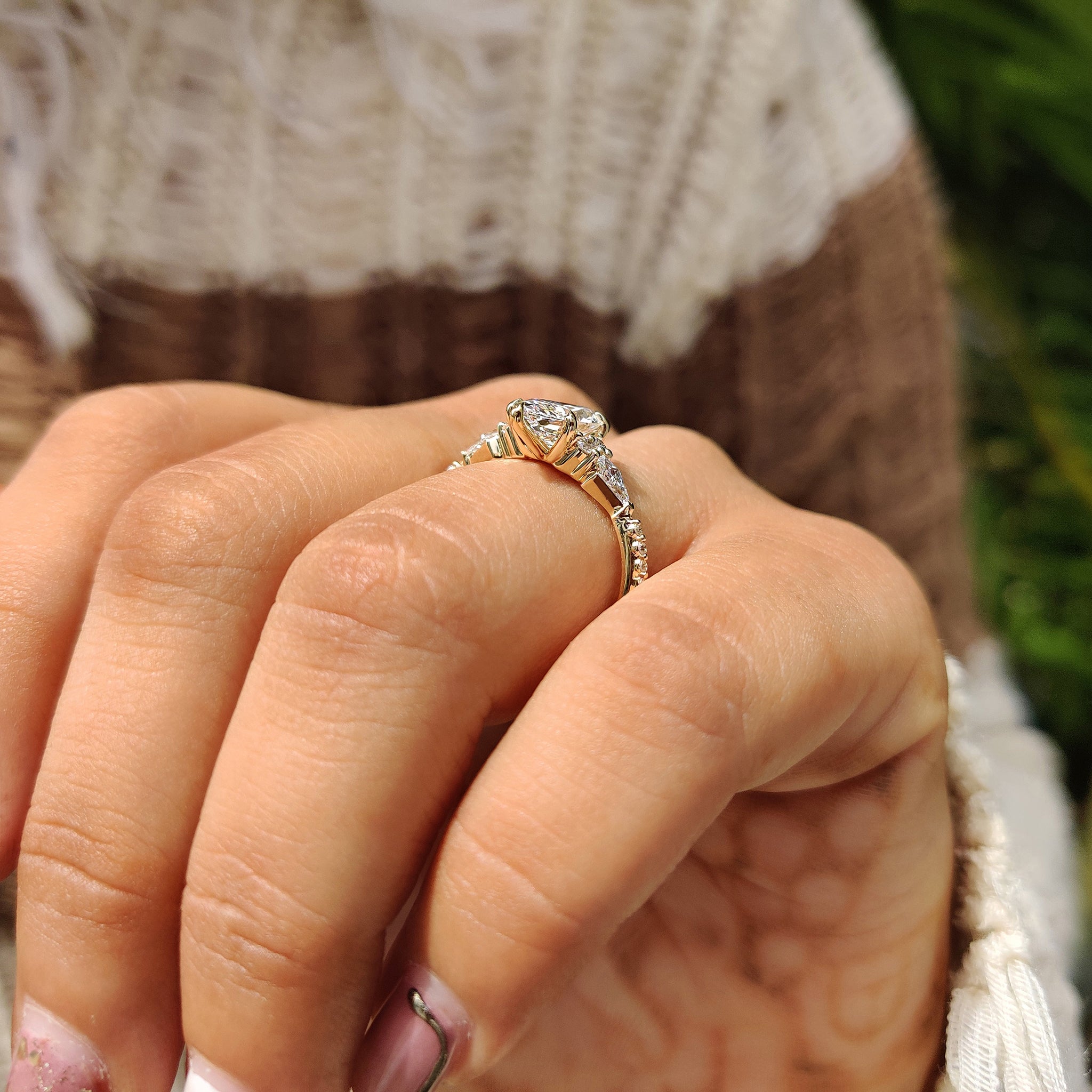Yellow gold engagement ring with tapered shank ring.
