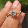 Round diamond engagement ring with nature inspired diamond ring.
